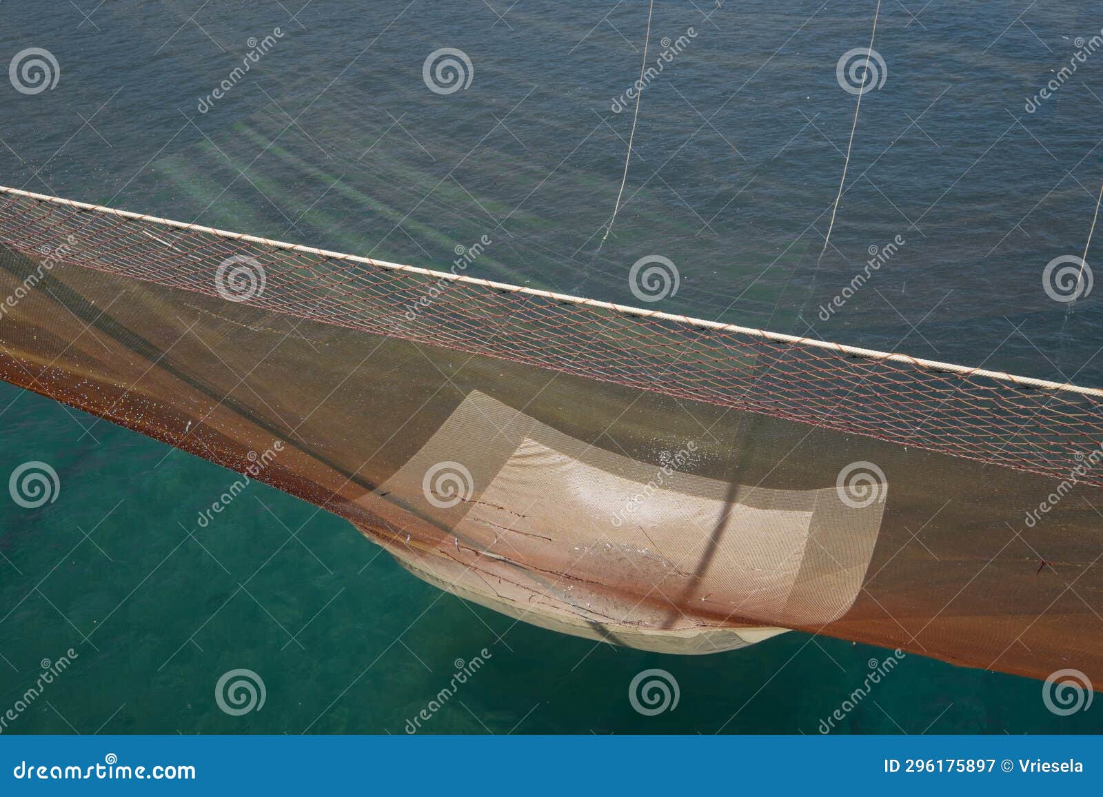 Huge Fishing Net is Pulled Up by Ropes in a Traditional Fishing Trabucco in  Italy Stock Image - Image of trabucco, beach: 296175897