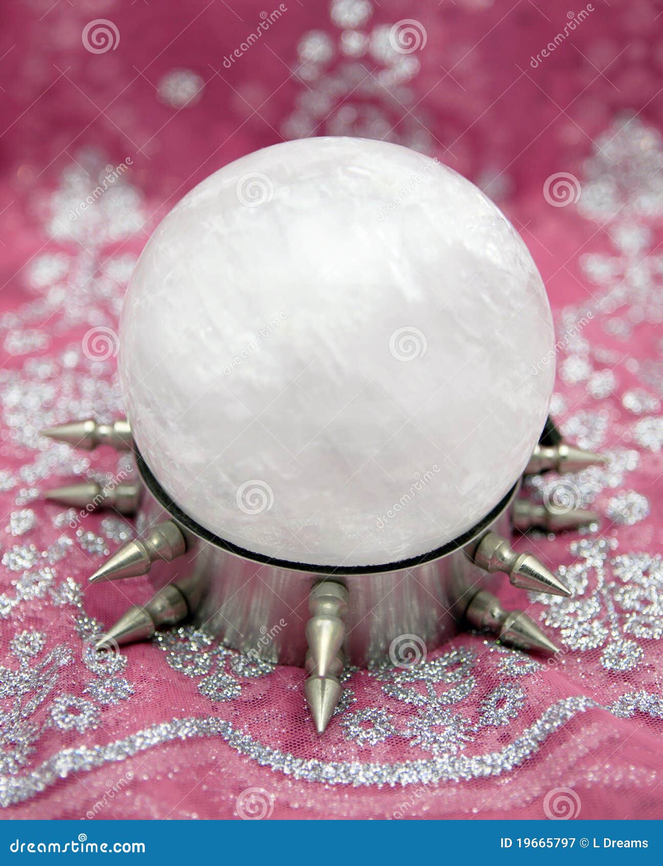 Premium Photo  A silver spiked ball with spikes is on a white surface.