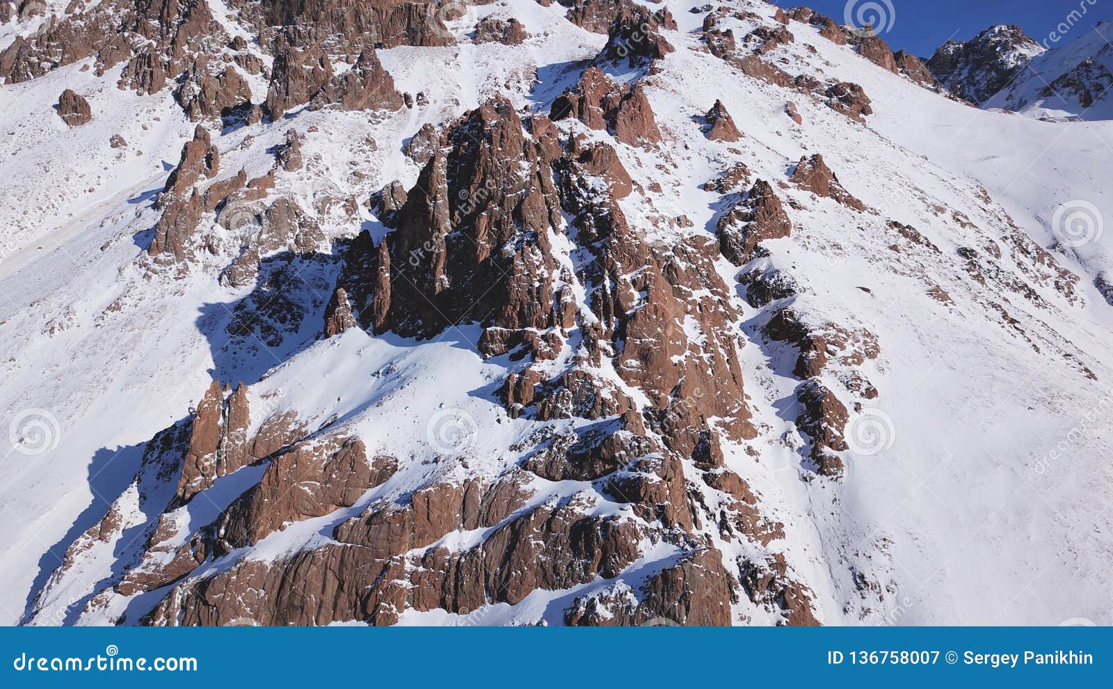 Huge Rocks Covered With Snow Ledges From The Snowy Mountains Stock Image Image Of Terrain Ledges