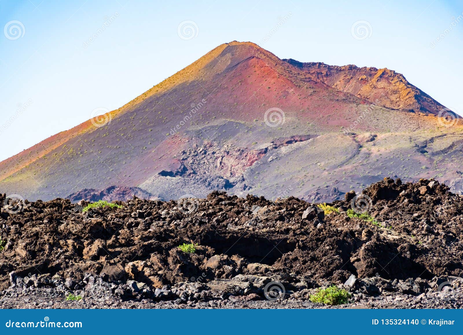 huge vulcano on the horizont from caldera de los cuervos, timanfaya national park, lanzarote, canary islands, spain