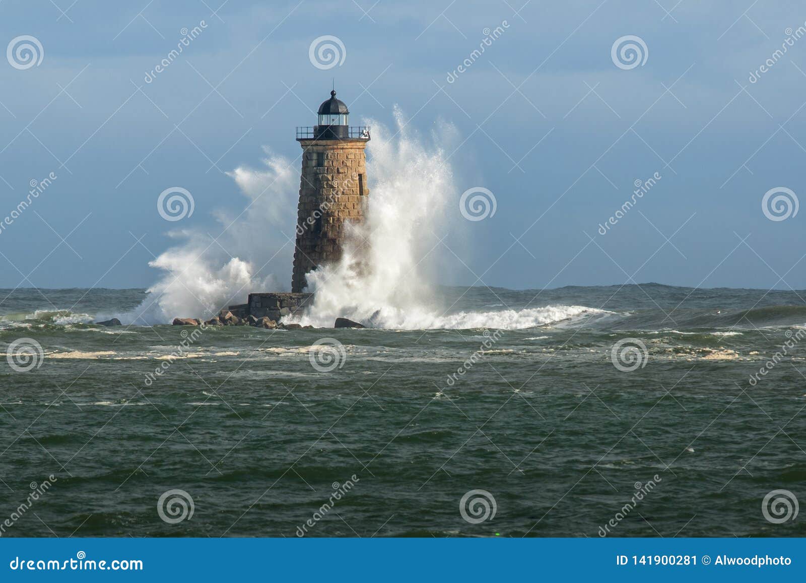 huge waves surround new england lighthouse