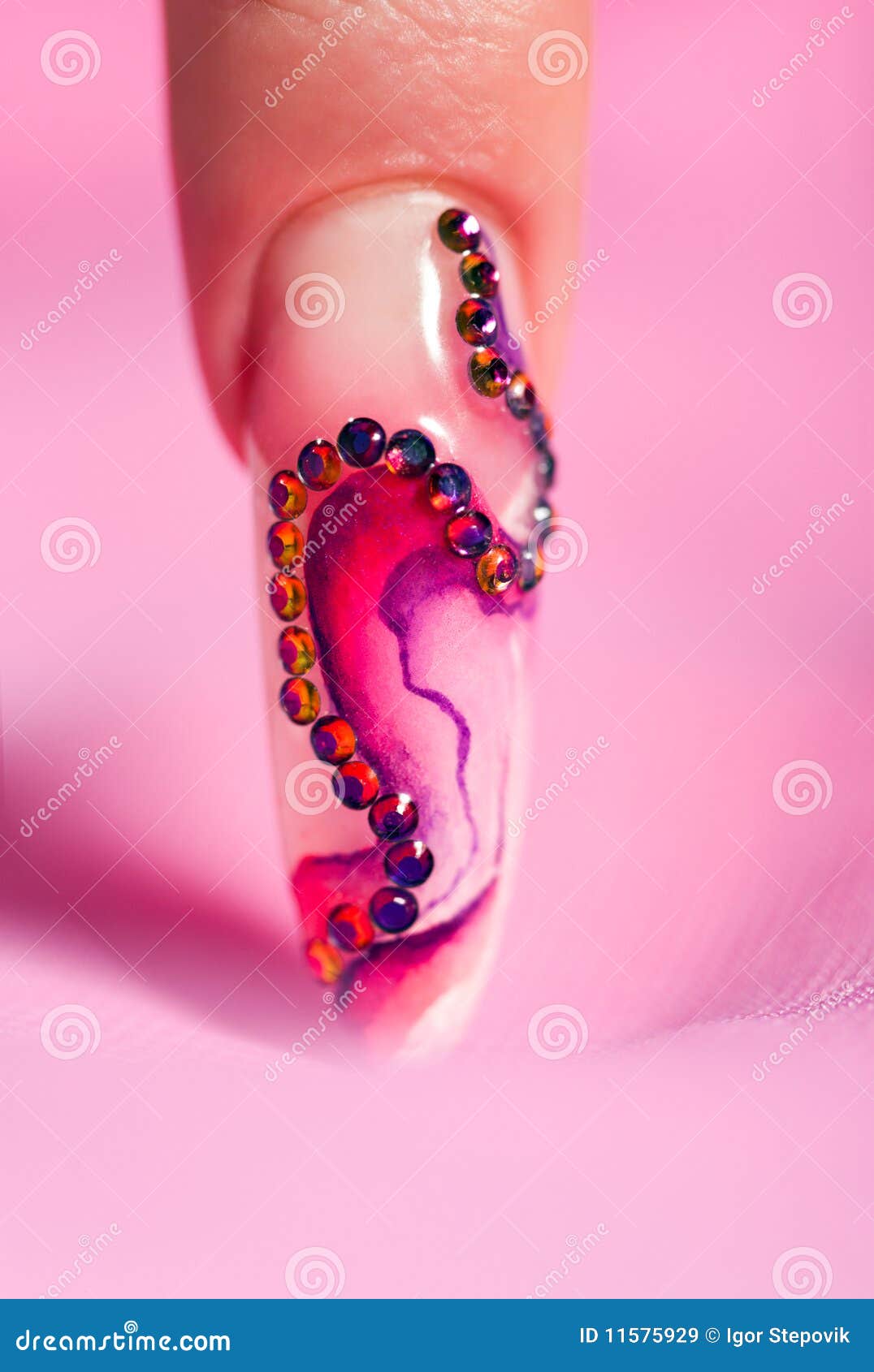 human finger with long fingernail over pink