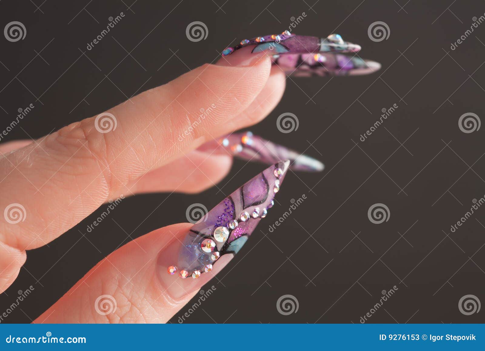 human fingers with long fingernail