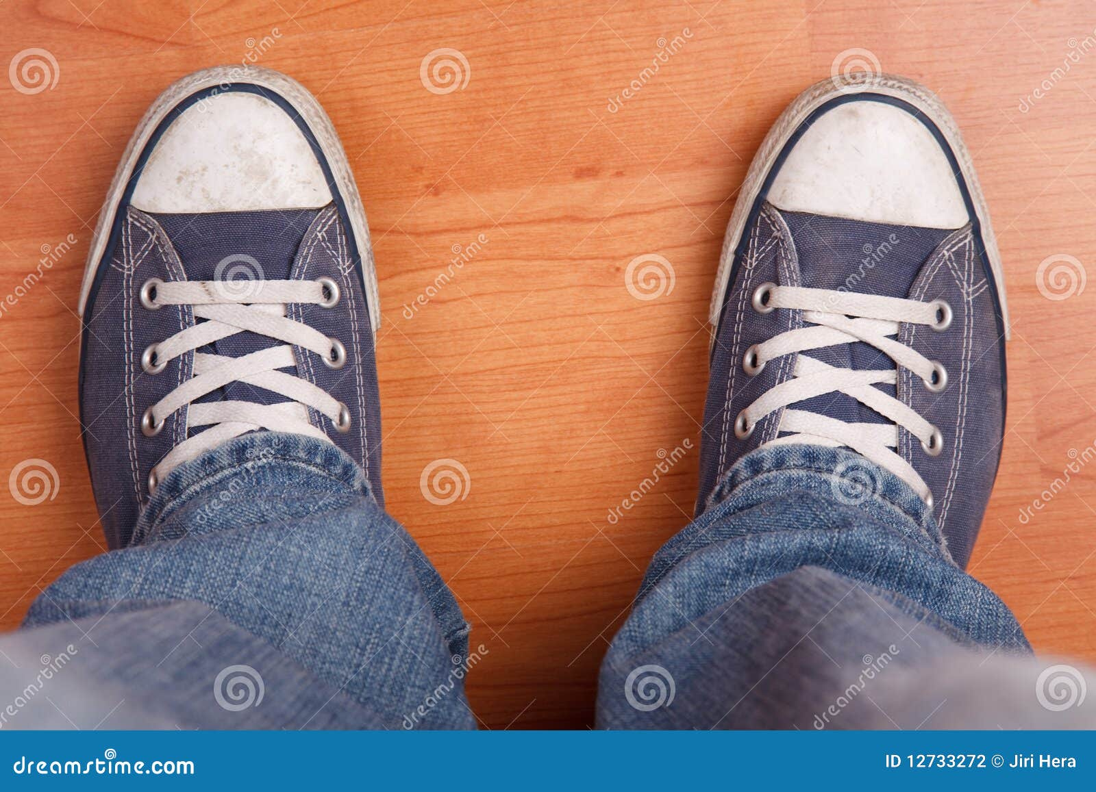 Human Foot With Jeans And Sneakers Stock Photography - Image: 12733272