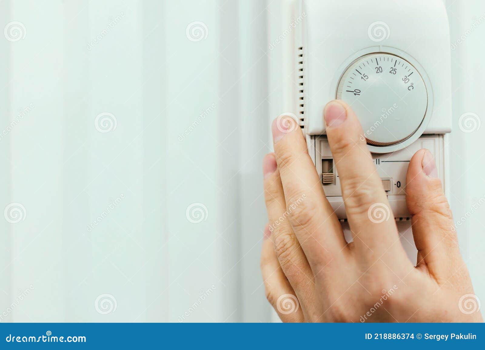 Human Hand on the Air Conditioner Temperature Controller. Service for