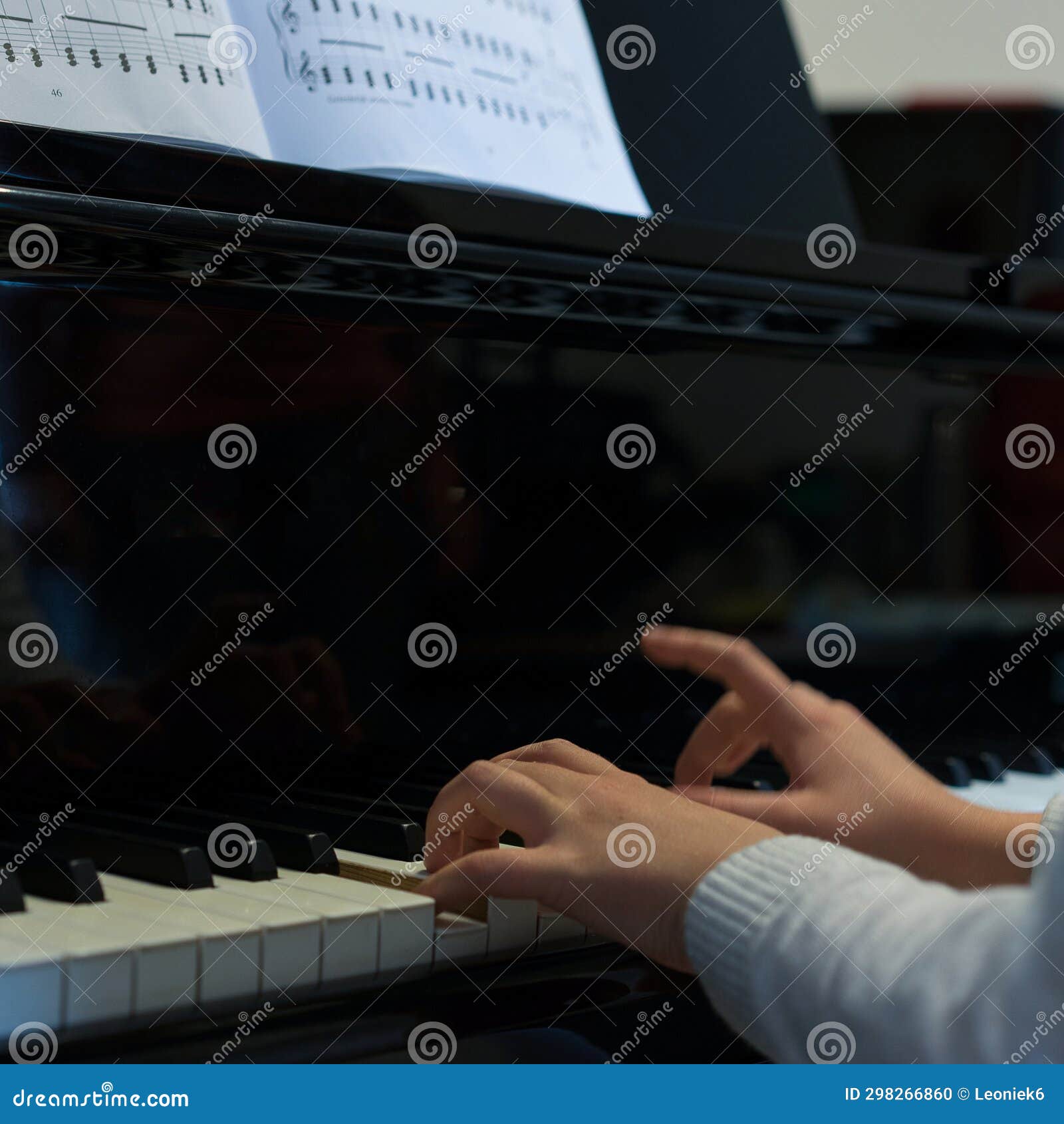 Human Hands Playing the Keys Notes and Chords on a Classic Black Piano