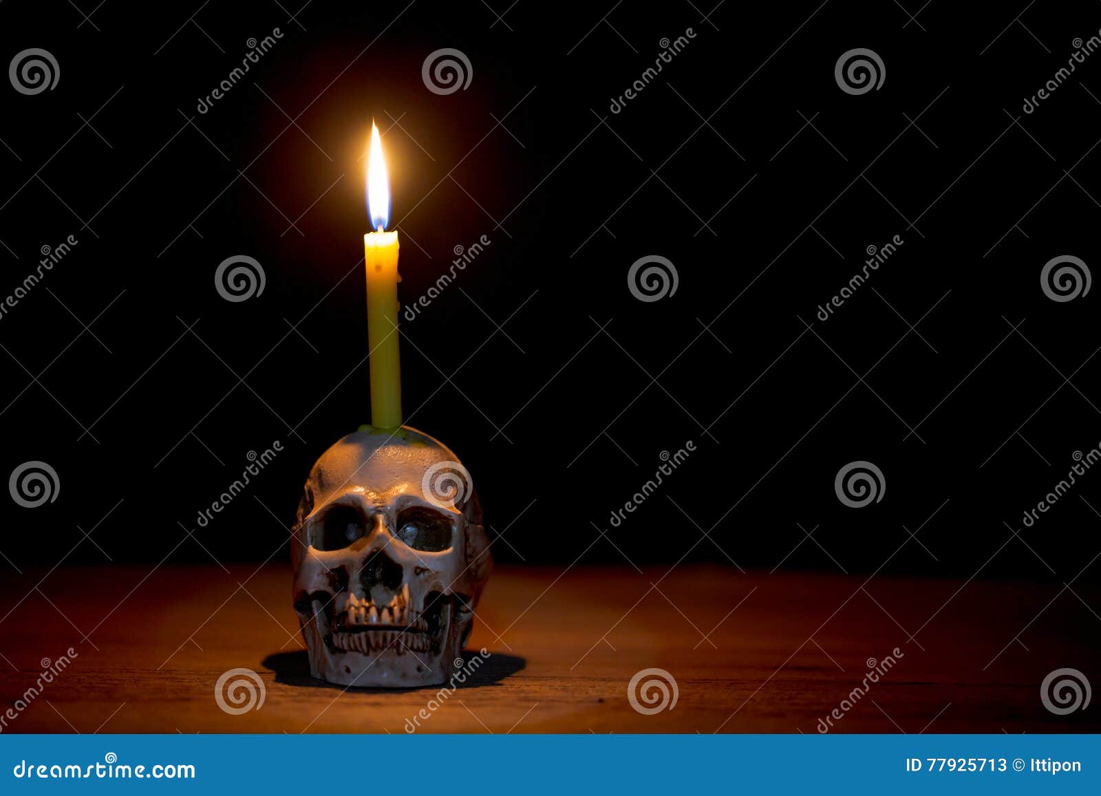 Human skull with candle stock image. Image of candle 77925713