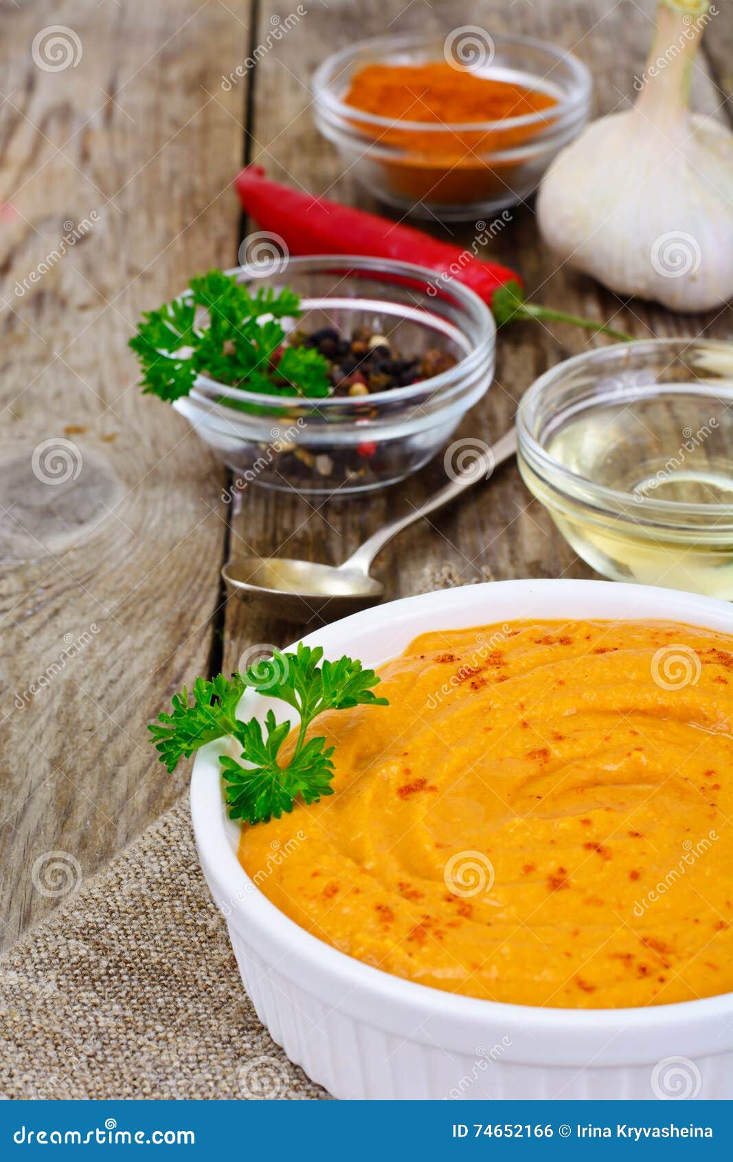 Hummus with Curry, Turmeric, Raw Chickpeas on the Boards Stock Photo