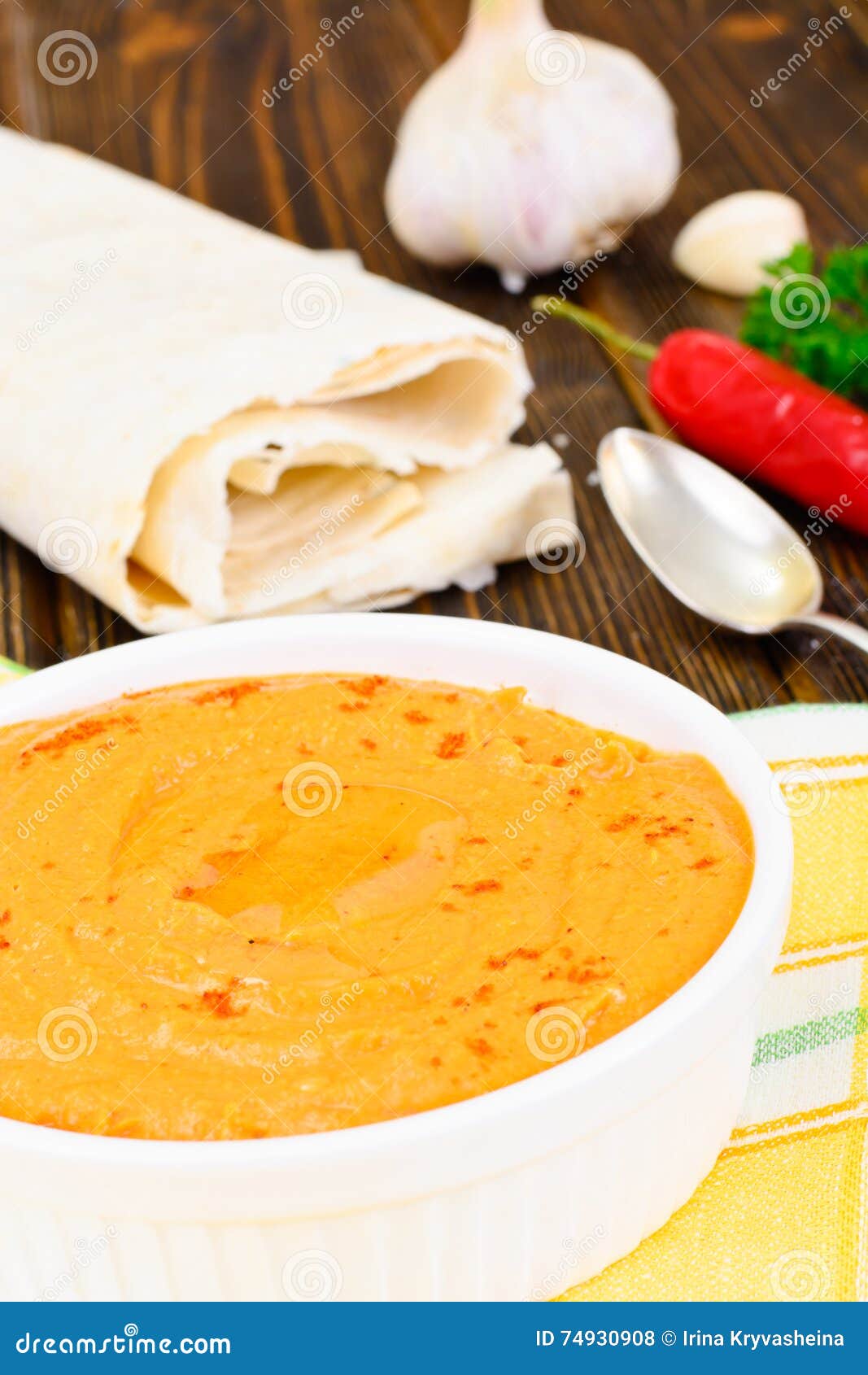 Hummus with Curry, Turmeric, Raw Chickpeas on the Boards Stock Photo