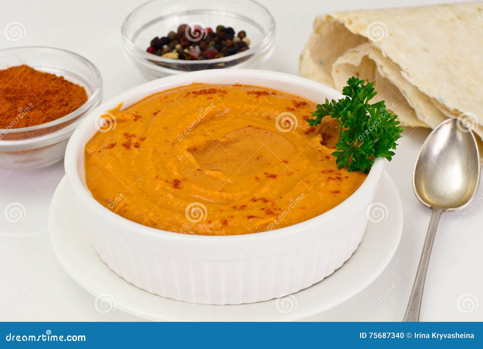 Hummus with Curry, Turmeric, Raw Chickpeas on the White Background