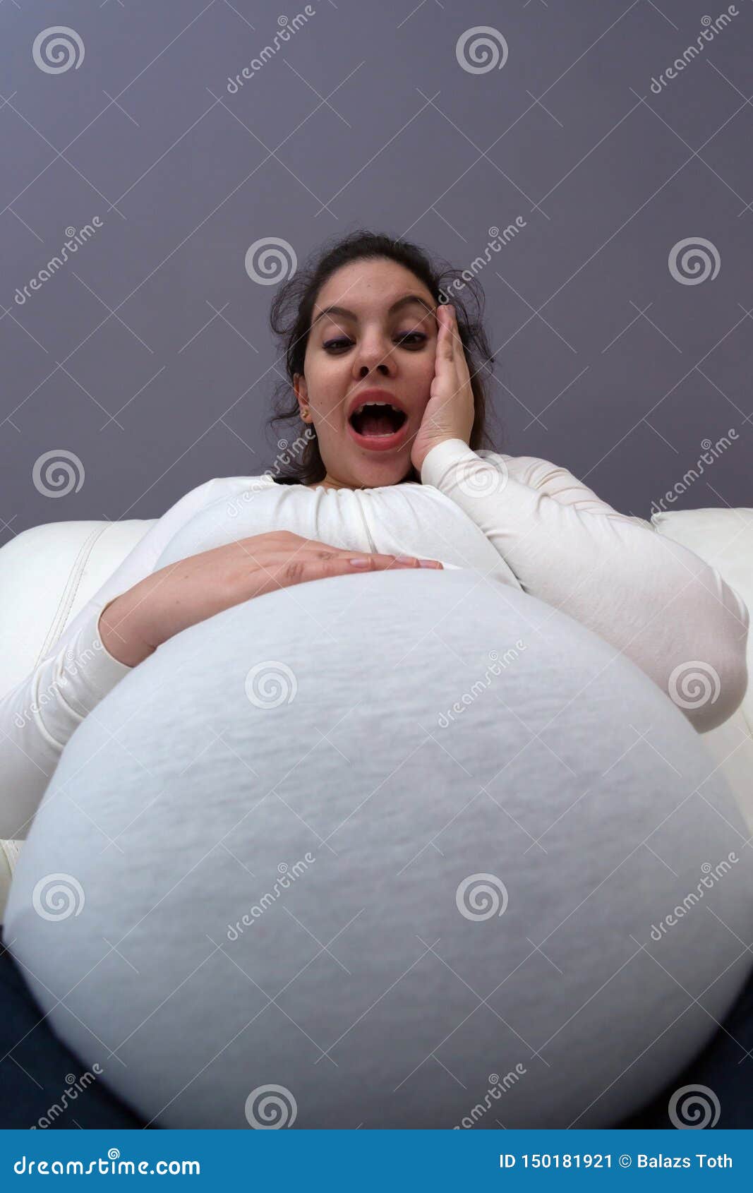 Extreme Angle View Of Pregnant Momâ€™s Giant Baby Bump Stock Image