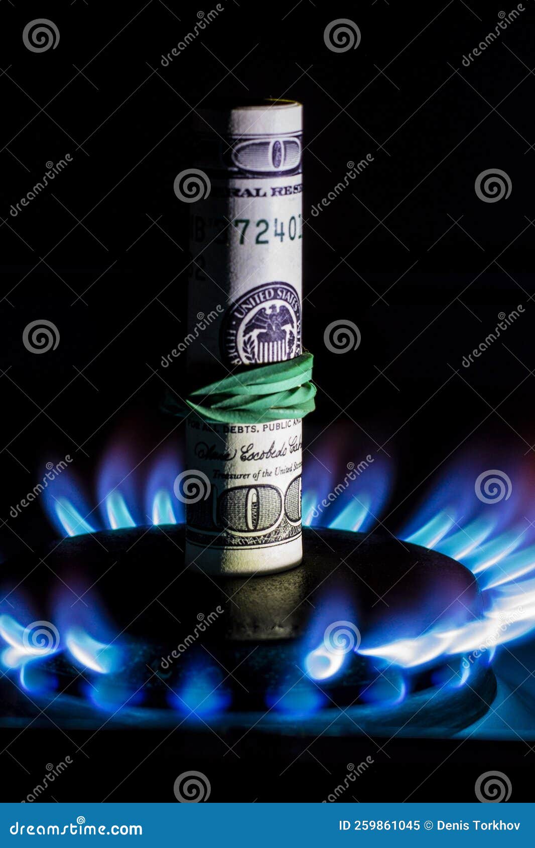 A Hundred Dollar Bill on a Gas Burner with a Burning Fire on a Black Background, the Front and