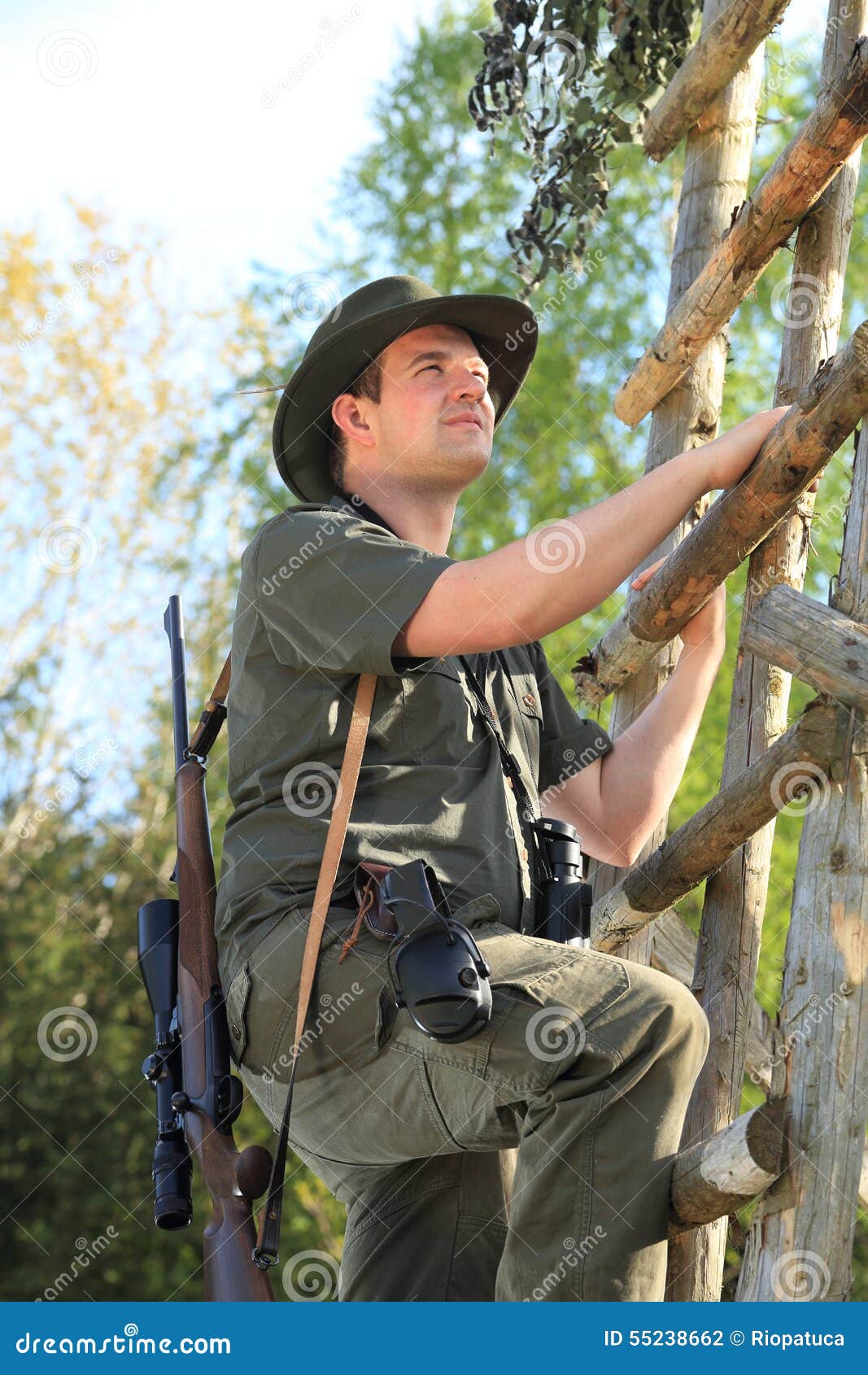 Hunter Climbing with Hearing Protection a High Seat Stock Photo Image