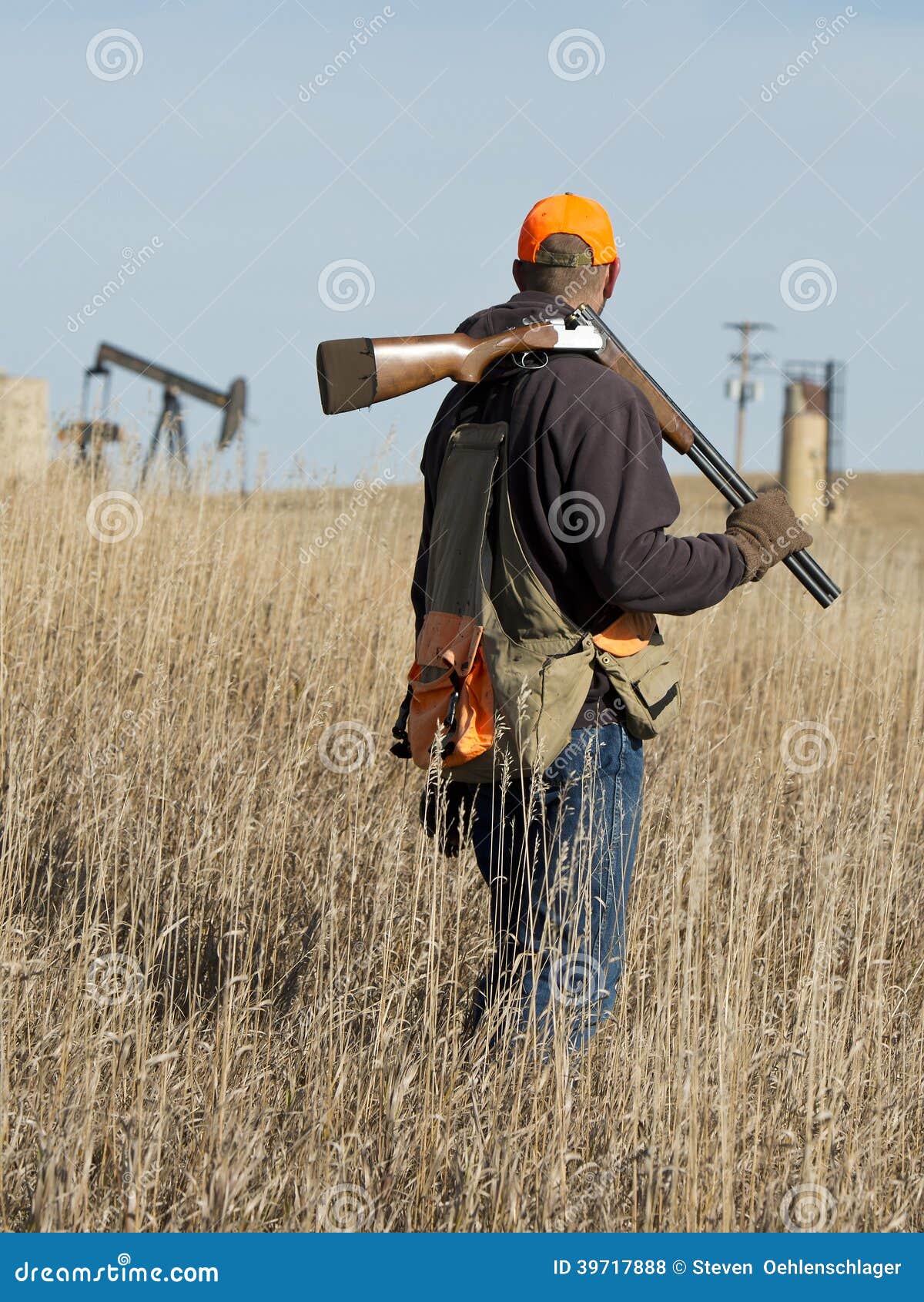 Hunter on the prairie stock photo. Image of shooting 39717888