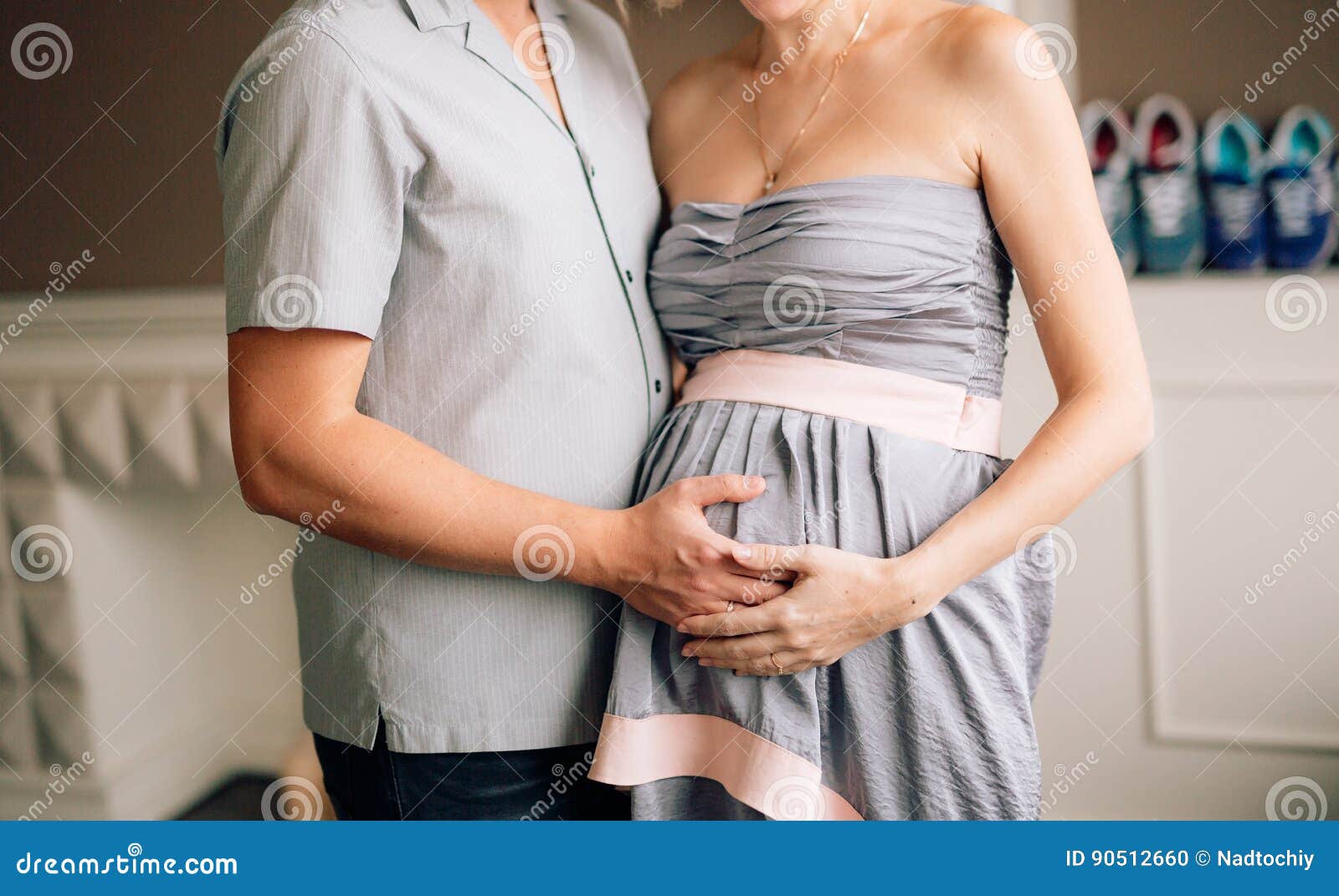 Husband Hugging Pregnant Wife photo