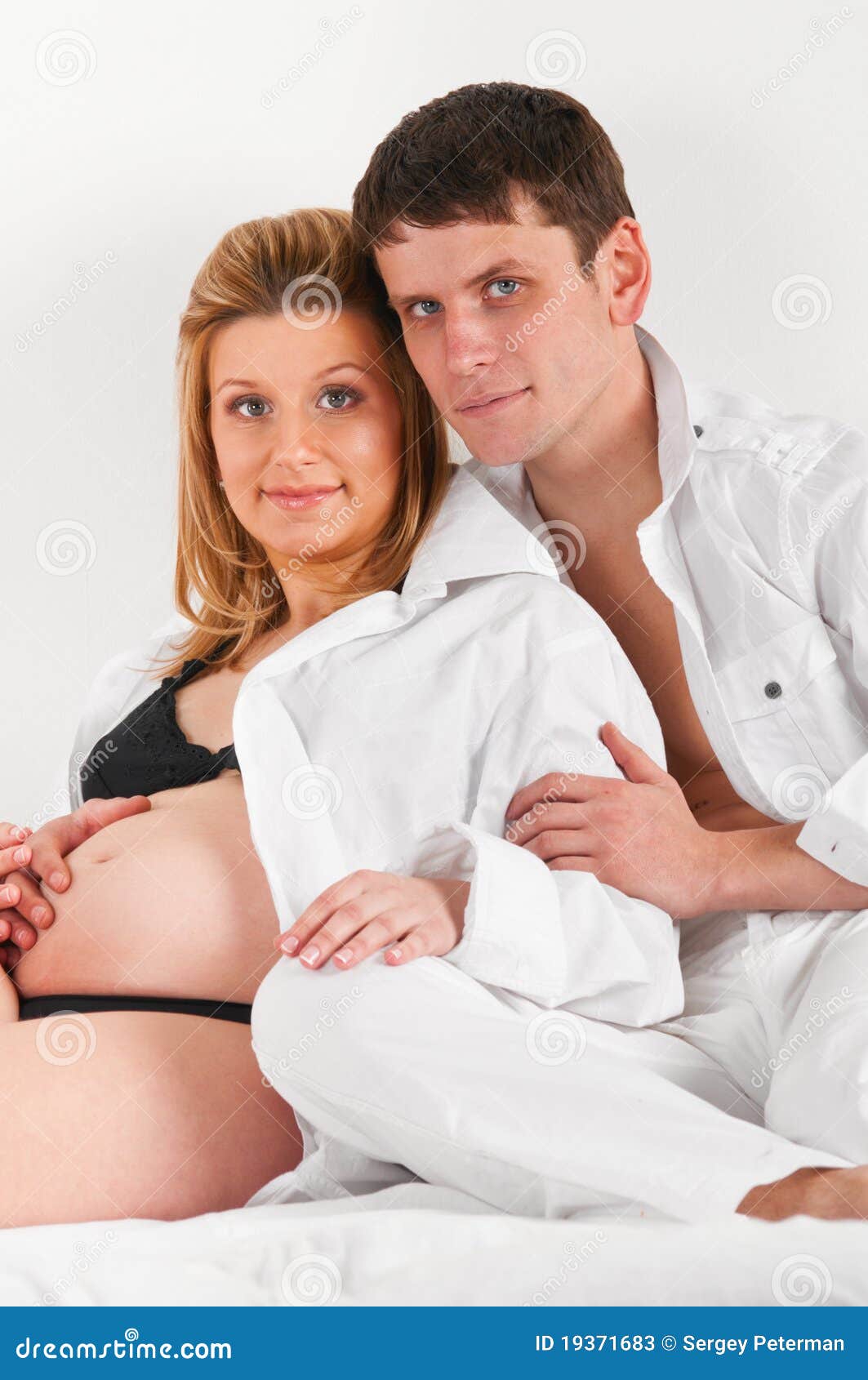 Husband and pregnant wife stock image