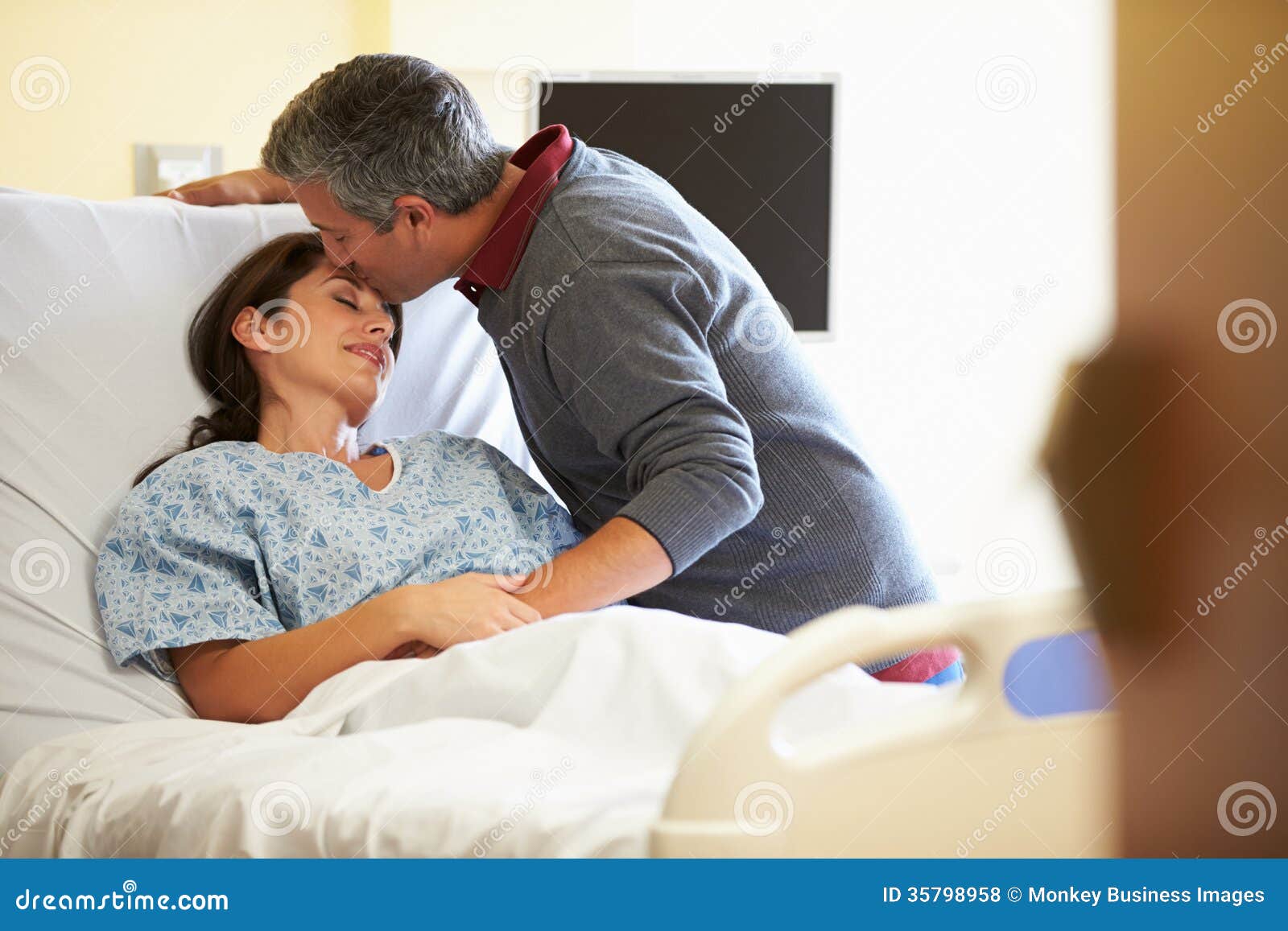 Husband Visiting Wife in Hospital Stock Photo