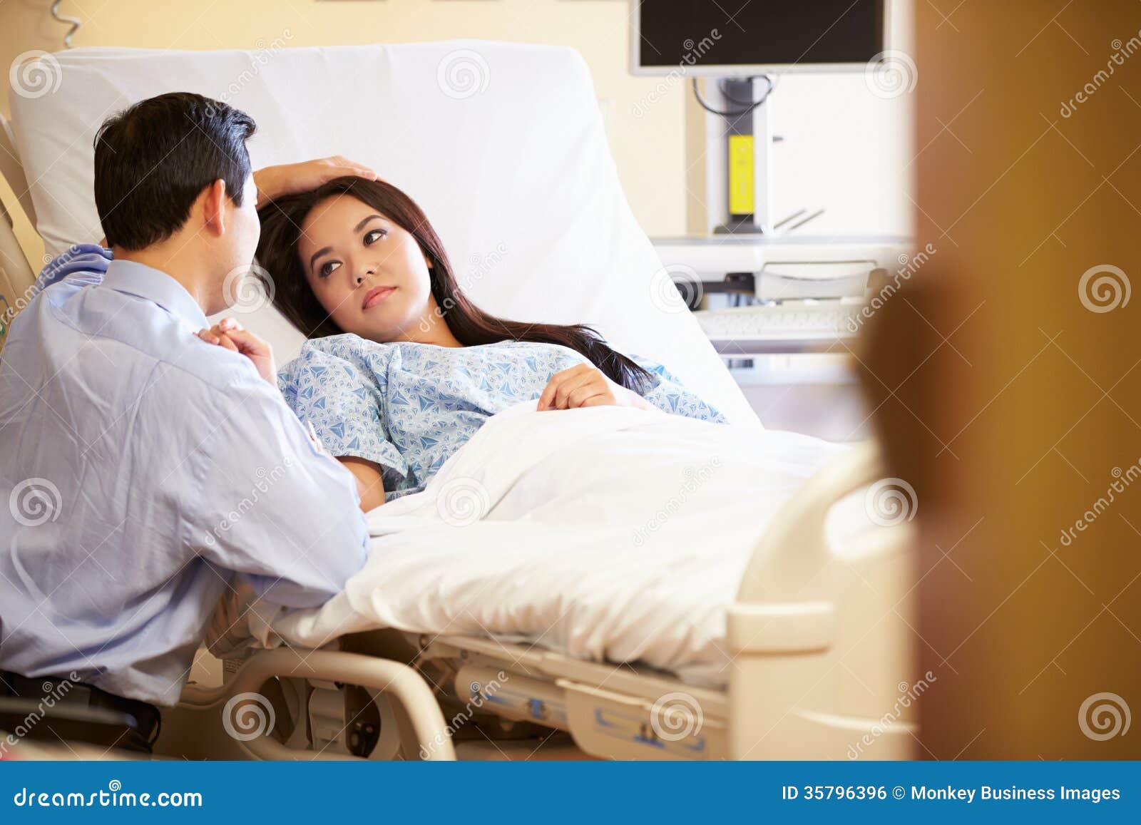 Husband Visiting Wife in Hospital Stock Photo