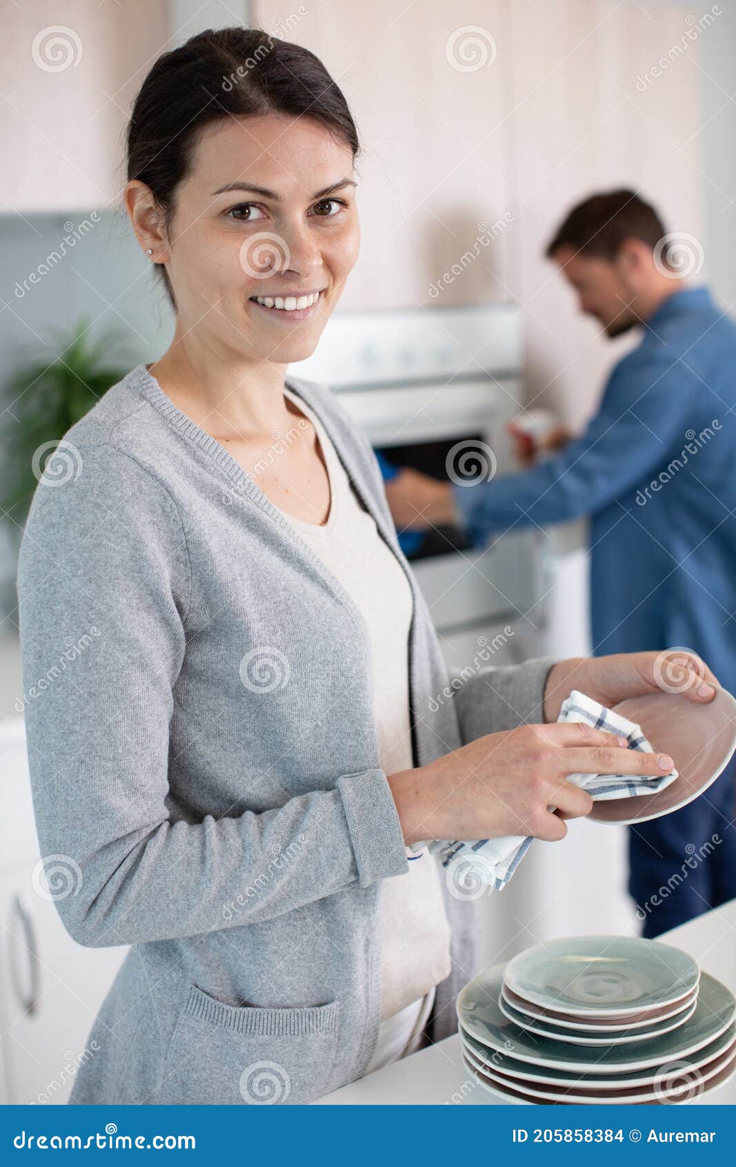 Husband and Wife Doing Dishes and Cleaning Kitchen Stock Photo Image