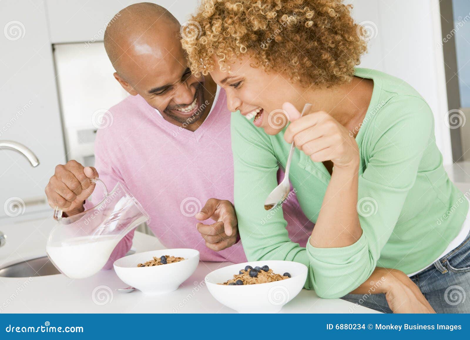 Husband And Wife Eating Breakfast Together Stock Images 