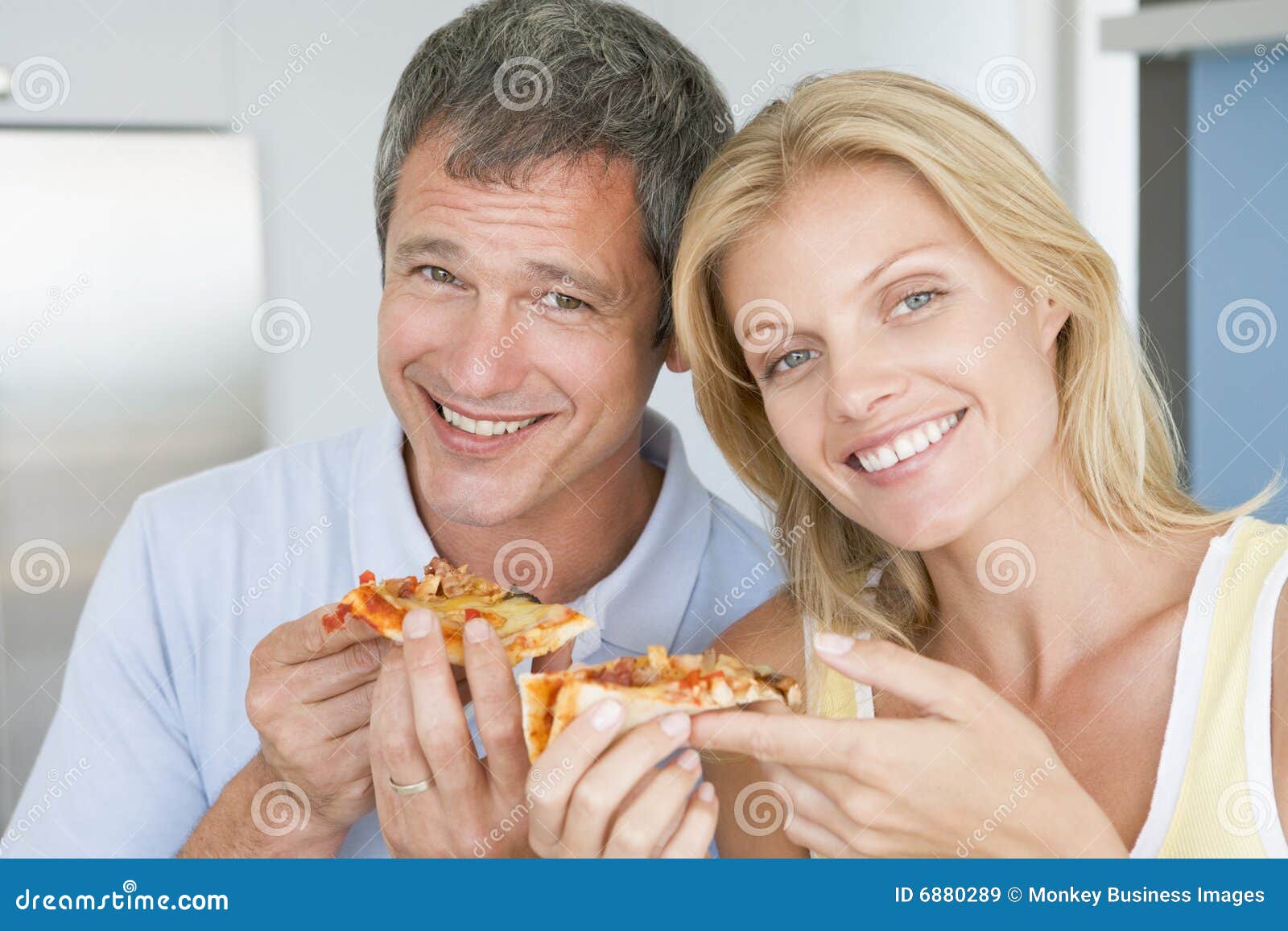 Husband And Wife Eating Pizza Royalty Free Stock Images photo