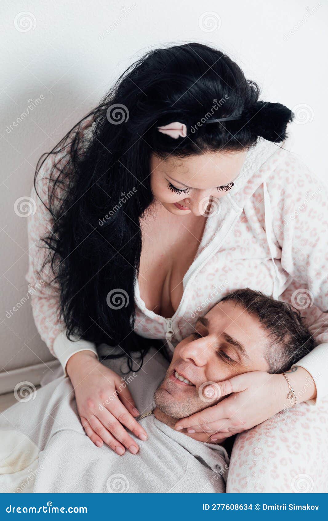 Husband and Wife Man and Woman Lovers in the Morning in the Bedroom Woke Up Stock Photo