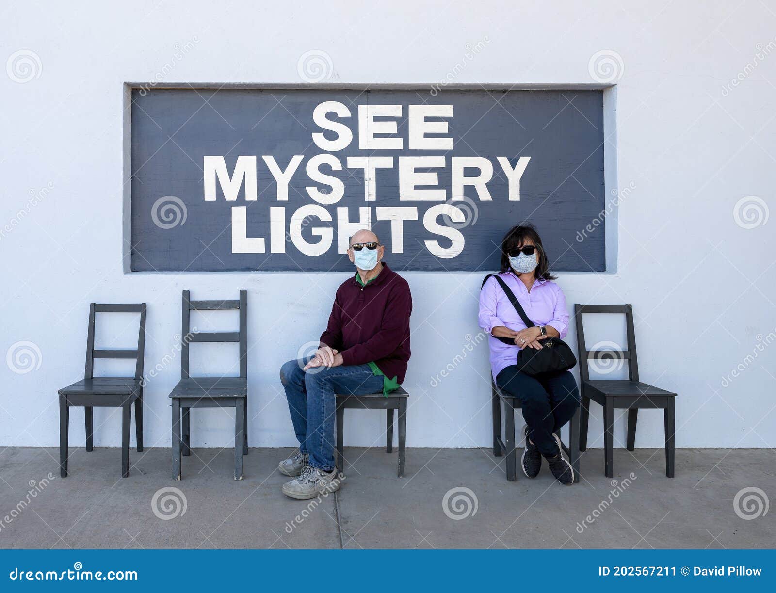 husband and wife at a photography spot in marfa, texas referring to the famous marfa mystery lights.