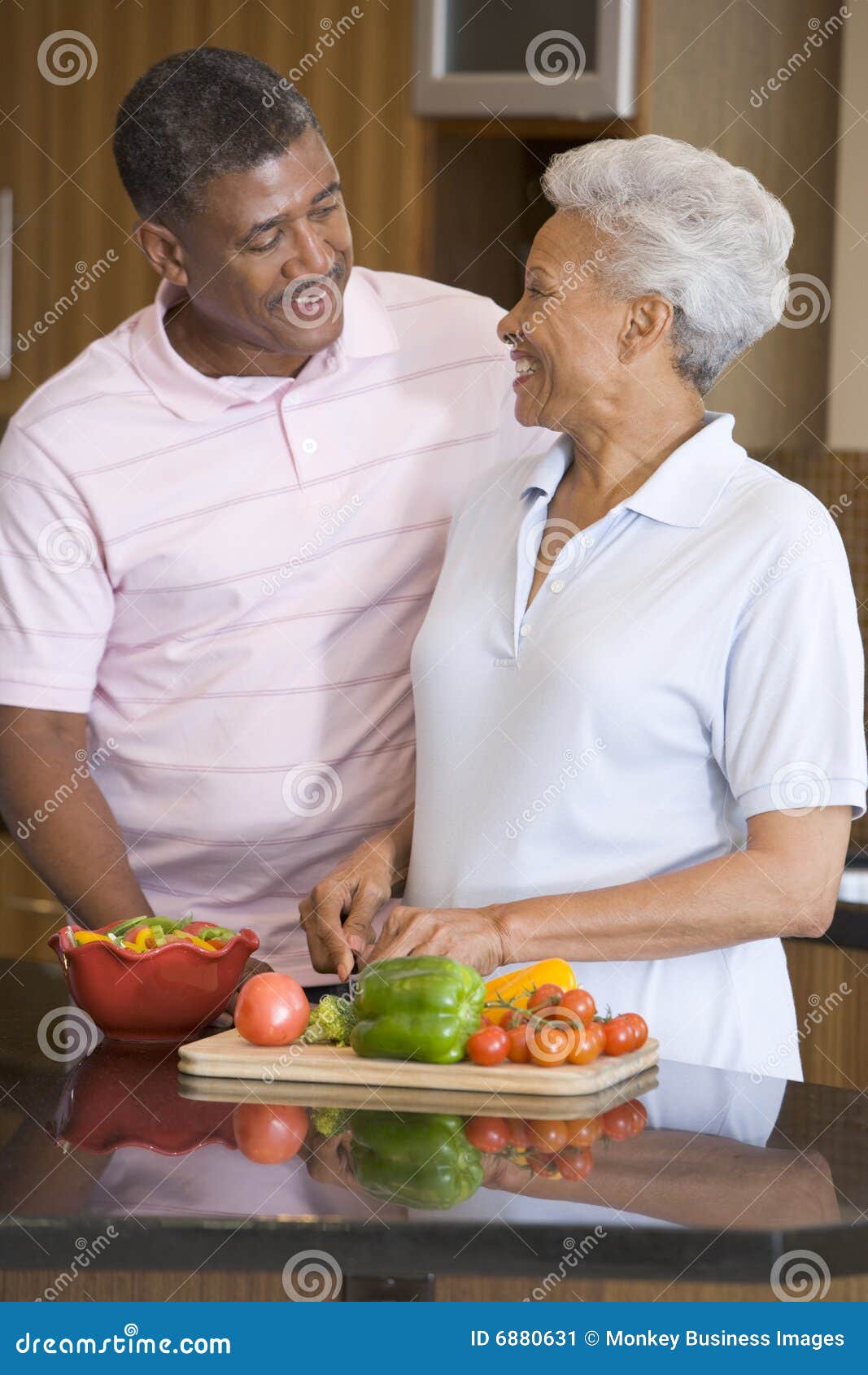 husband and wife preparing meal