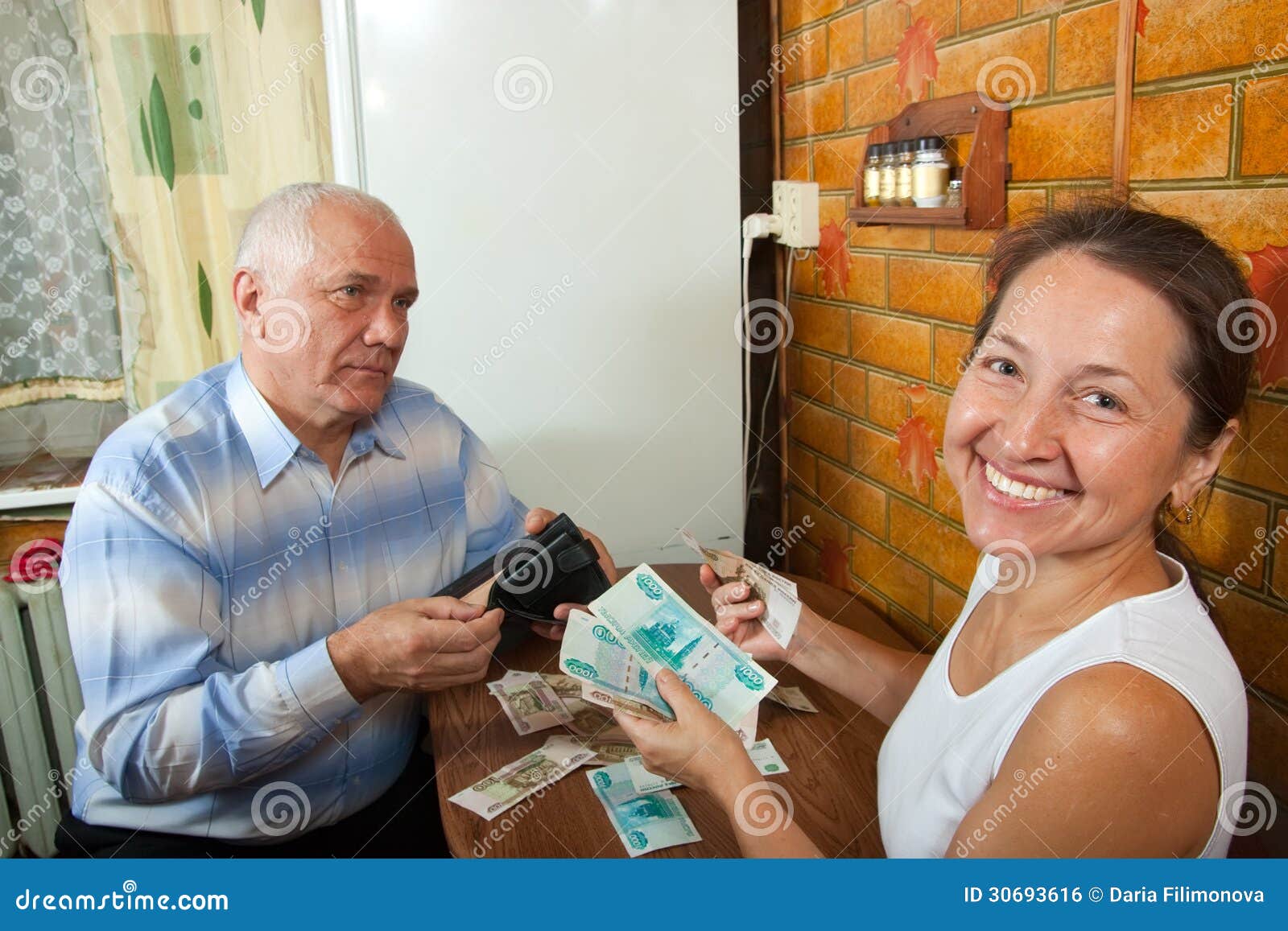 Husband and Wife Sharing Money Stock Photo photo Husband and Wife Sharing Money Stock Photo pic photo