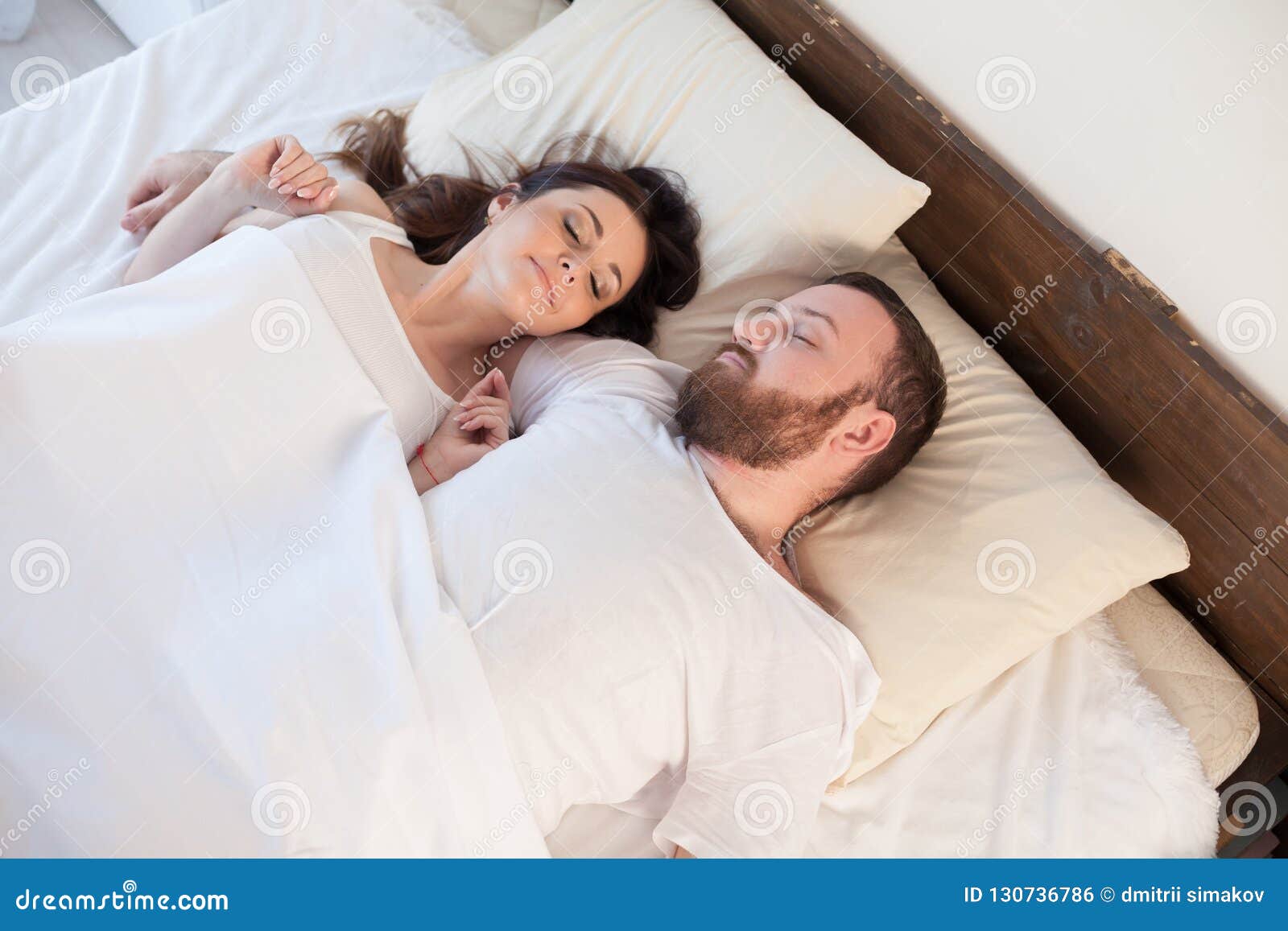 Husband And Wife Wake Up In The Morning In A Bedroom Love Stock Pho
