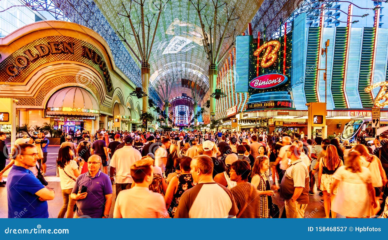 Hustle And Bustle Of Crowds In The Evening On The Famous Fremont Street In  The Heart Of Downtown Las Vegas With Its Many Casinos Editorial Photography  - Image Of Lights, Casino: 158468527