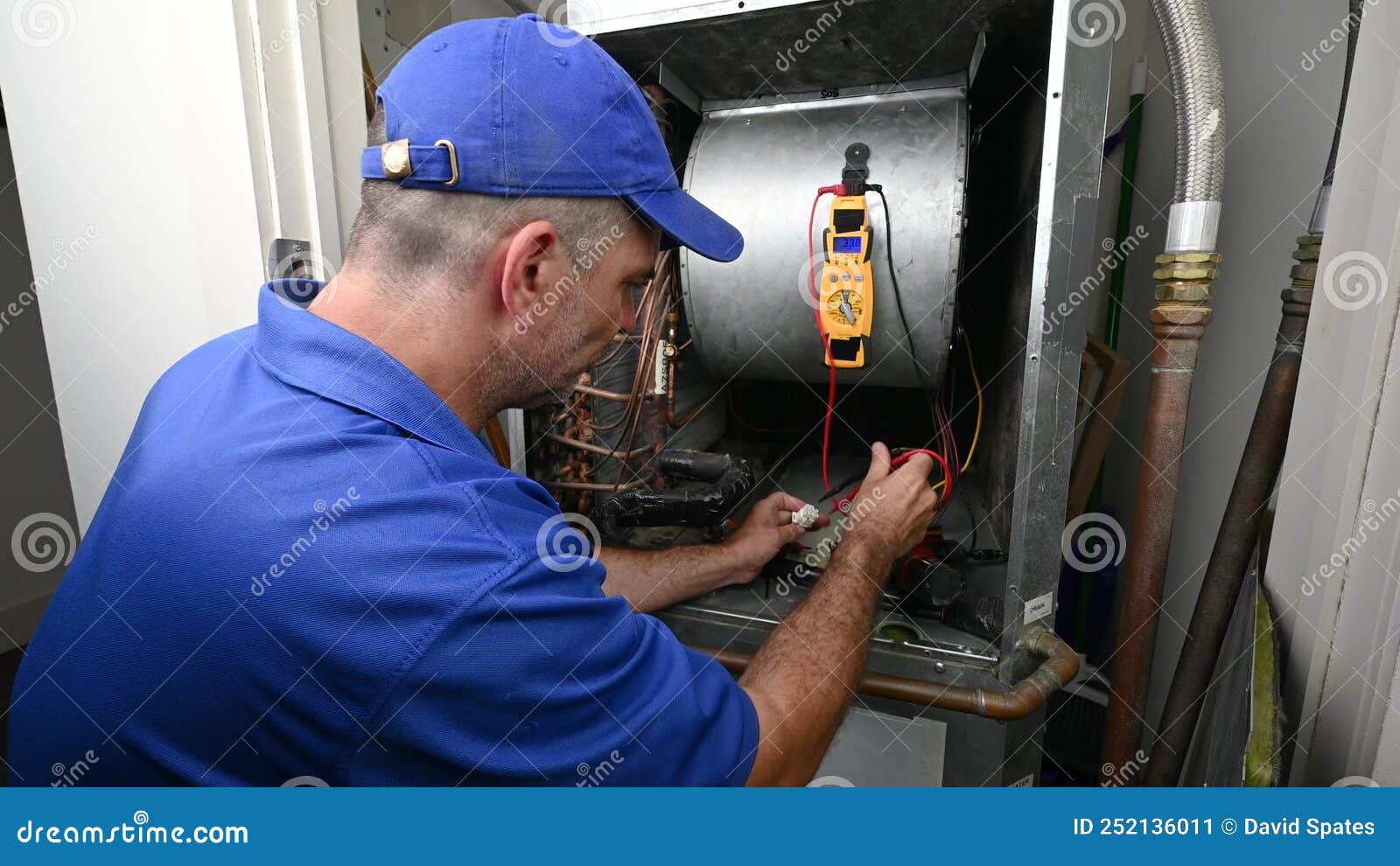 HVAC Technician Checking Voltage on a Wiring Harness Stock Video