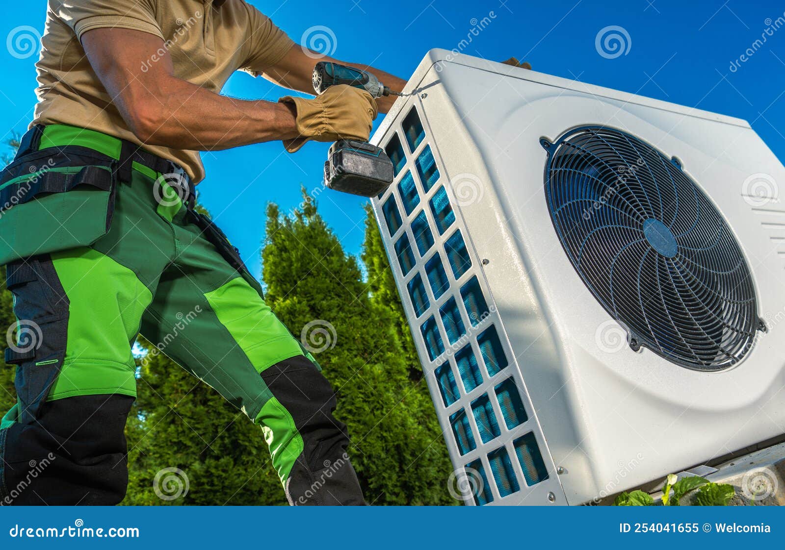 hvac technician installing large modern heat pump