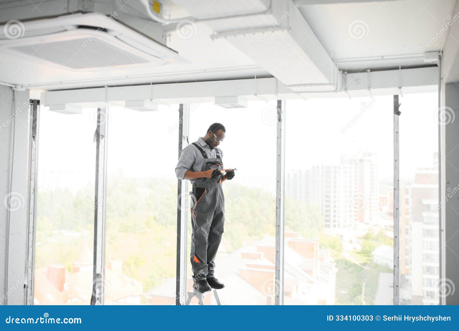 hvac worker install ducted pipe system for ventilation and air conditioning. copy space