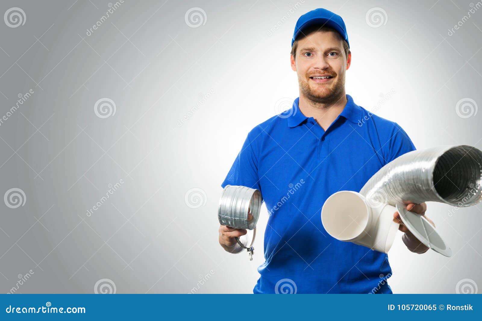 Hvac Worker with Ventilation System Equipment in Hands on Gray Stock