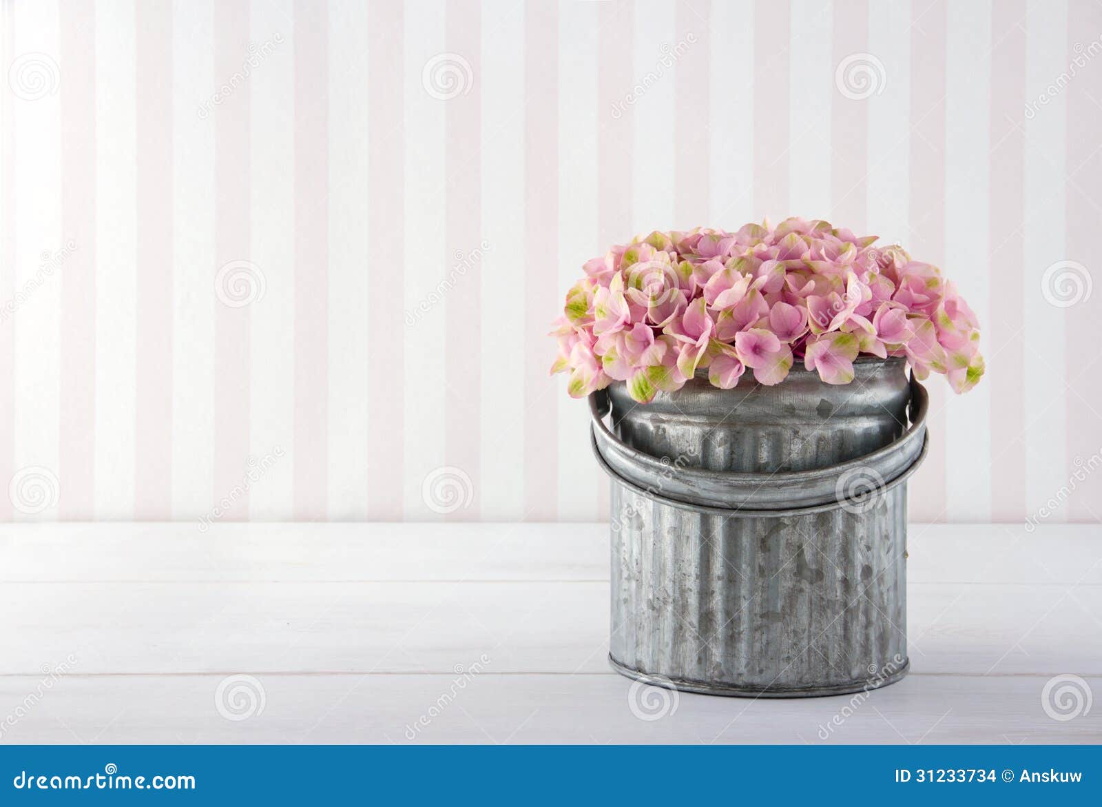 hydrangea flowers in a metal bucket