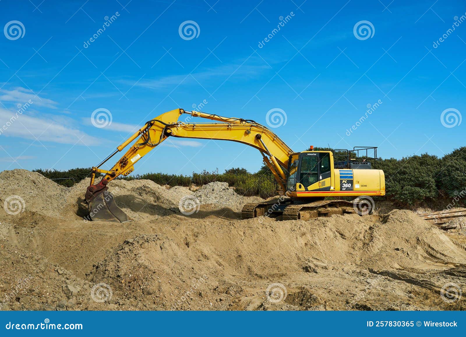 Hydraulic Excavator Removing Remains Of Asphalt. Road Reconstruction
