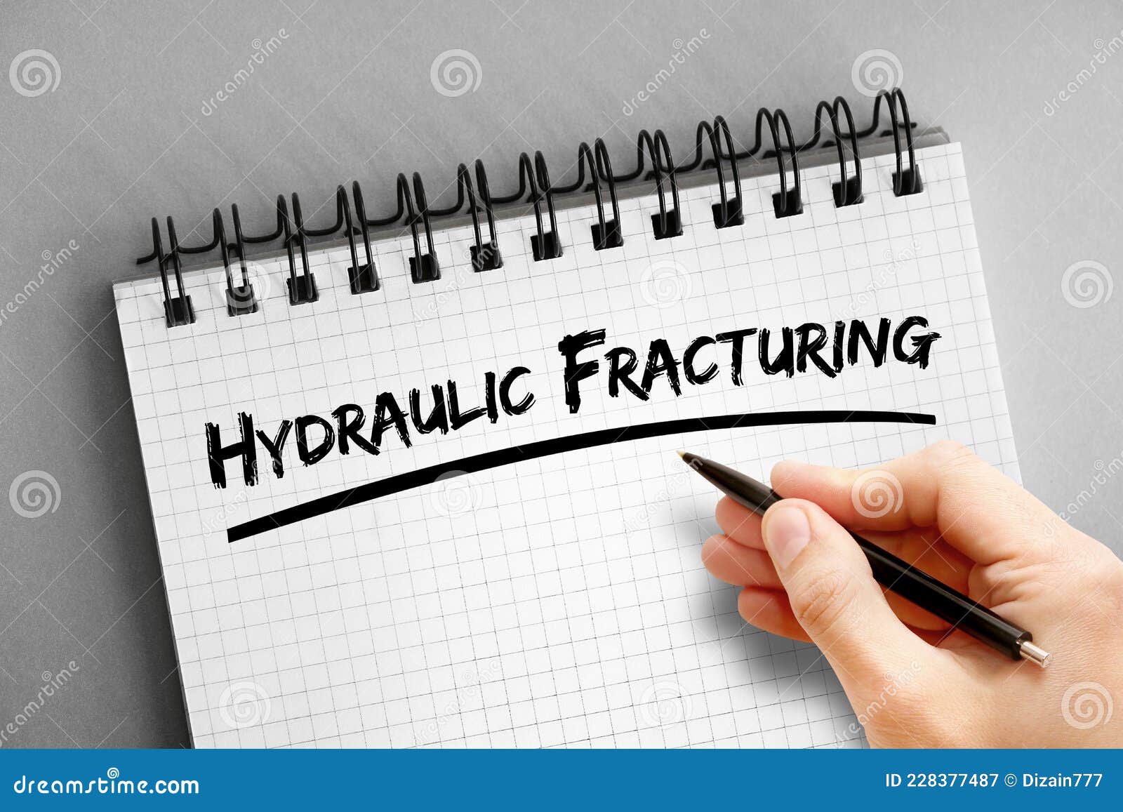 hydraulic fracturing text on notepad, concept background