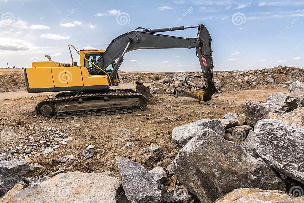 Hydraulic Hammer Drilling Stone in a Mine Editorial Photo Image of