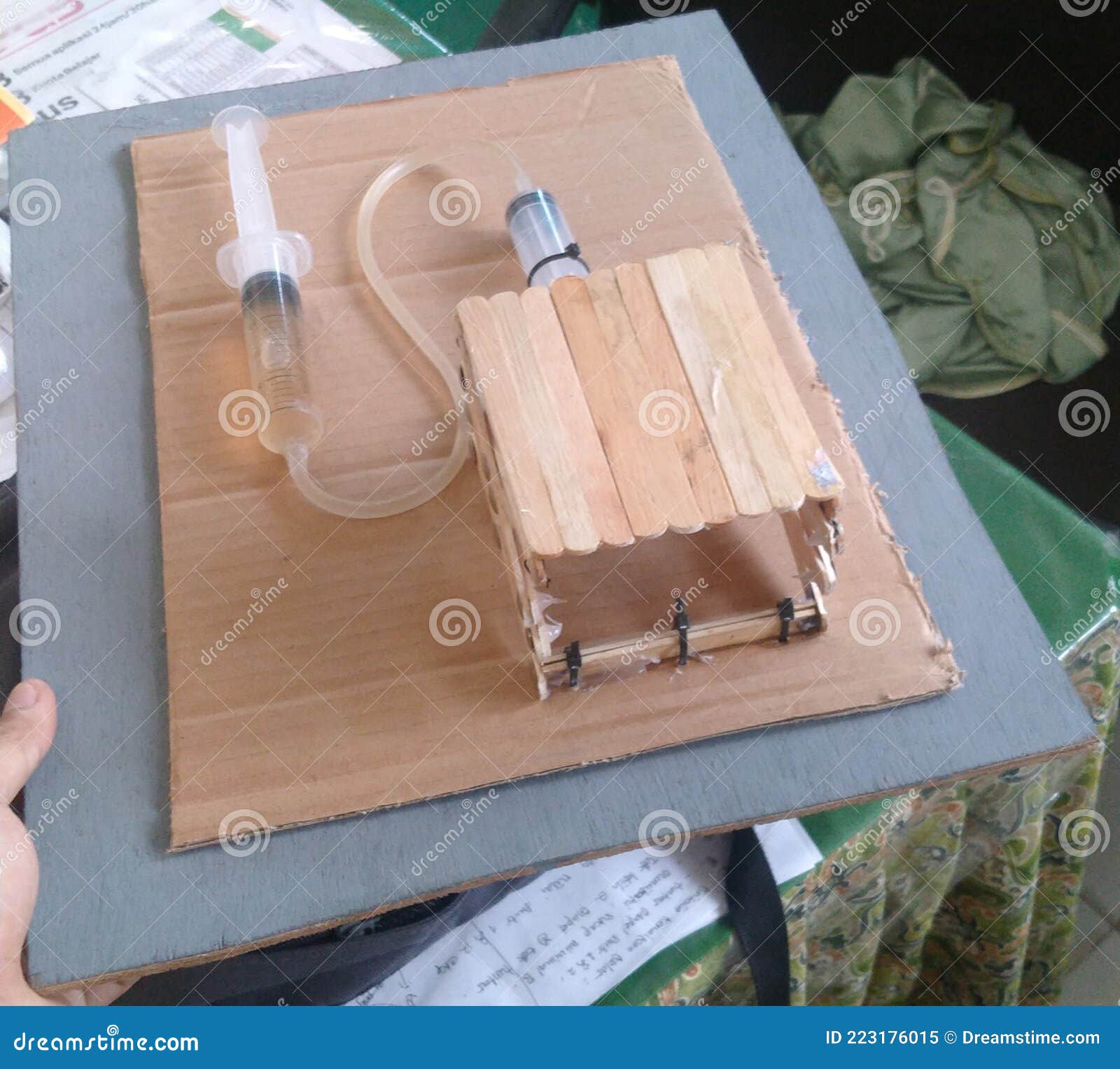 The Hydraulic Jack Is Installed Under The Car And Lifting It Stock