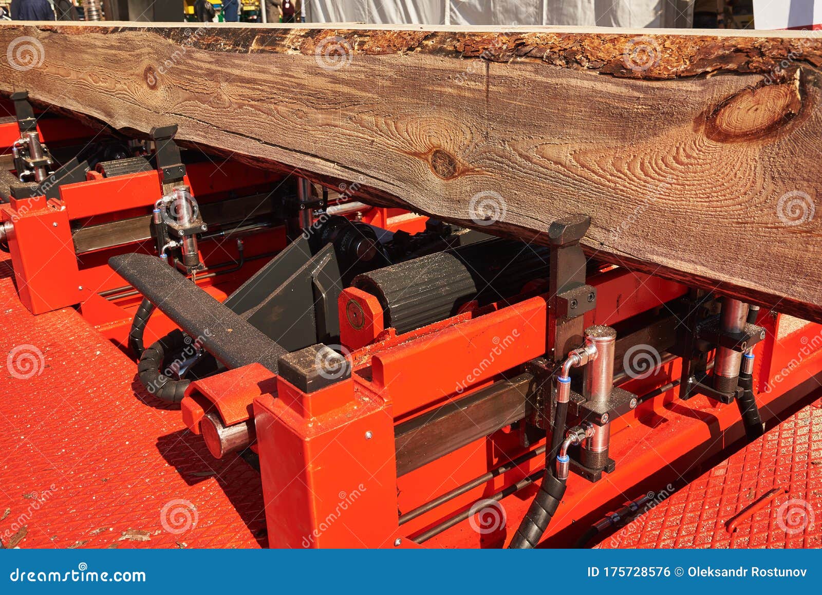 Hydraulic Log Clamps on the Frame of a Woodworking Machine Stock Photo