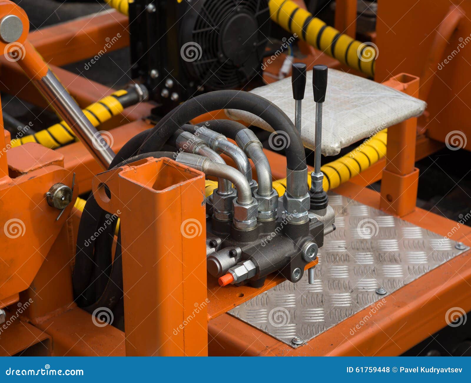 Hydraulic Tubes, Fittings and Levers on Control Panel Stock Photo