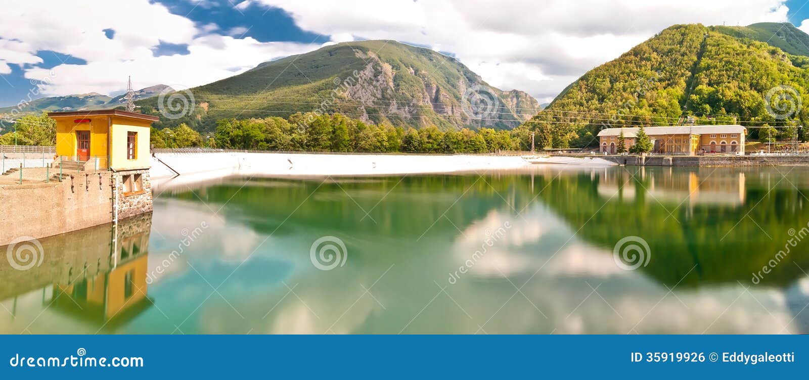 hydro-electric power plant and lake in ligonchio, emilia apennines, italy