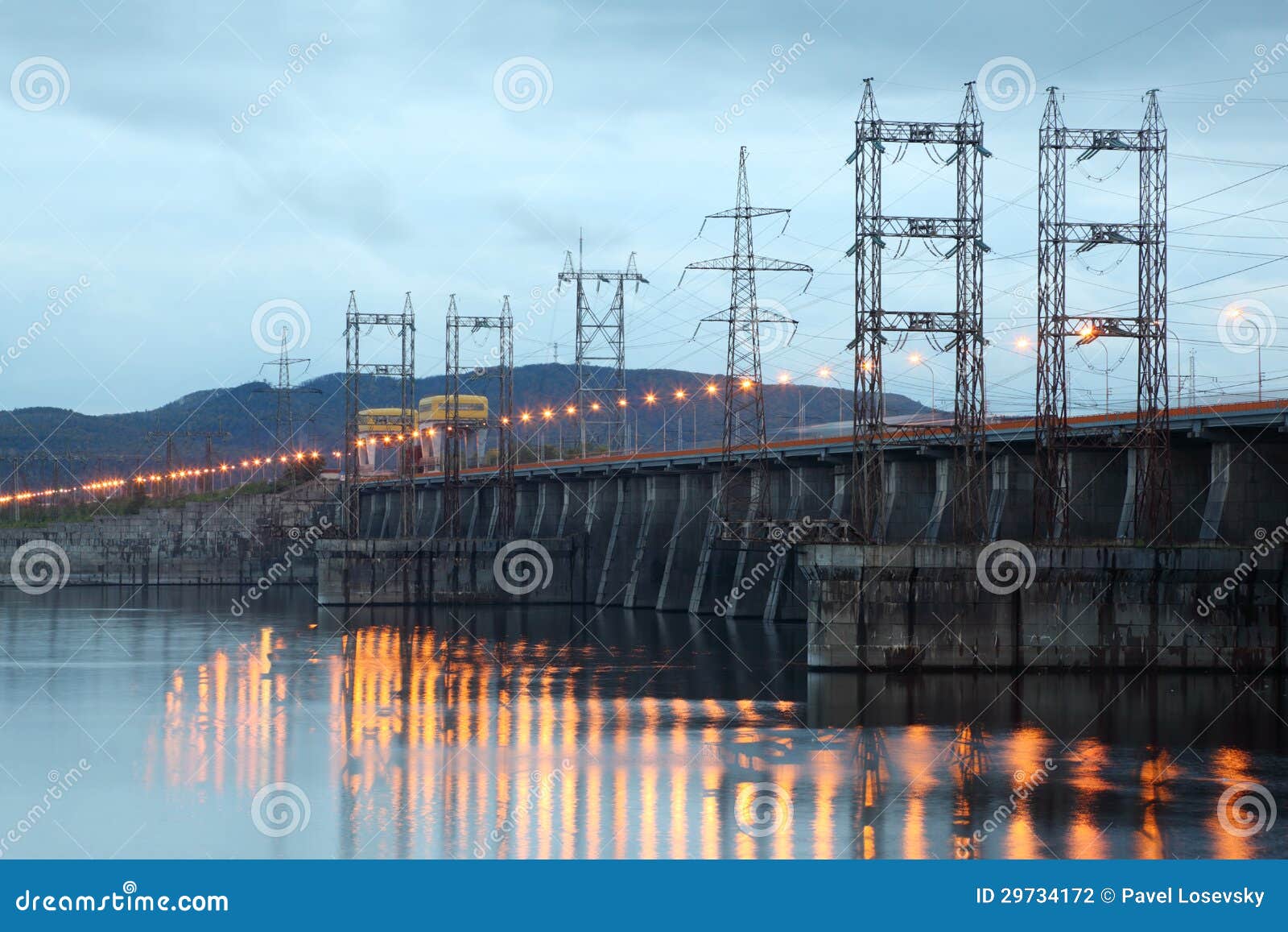 hydroelectric power station on river at evening
