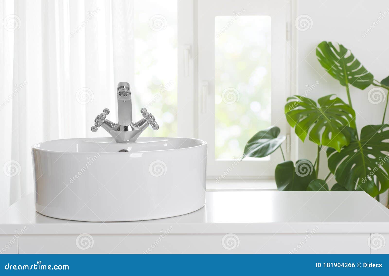 hygienic wash basin with chrome faucet on bathroom window background