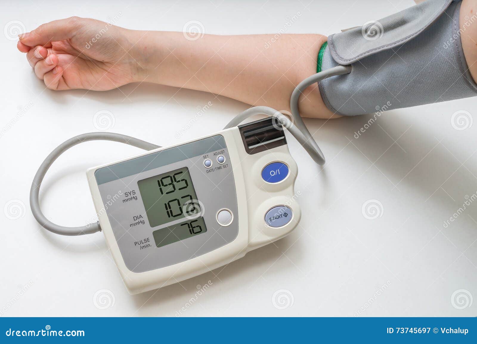 hypertension concept. man is measuring blood pressure with monitor
