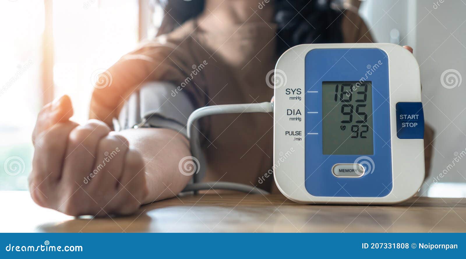 hypertension or high blood pressure illness in patient with blood pressure monitoring, measurement on digital sphygmomanometer