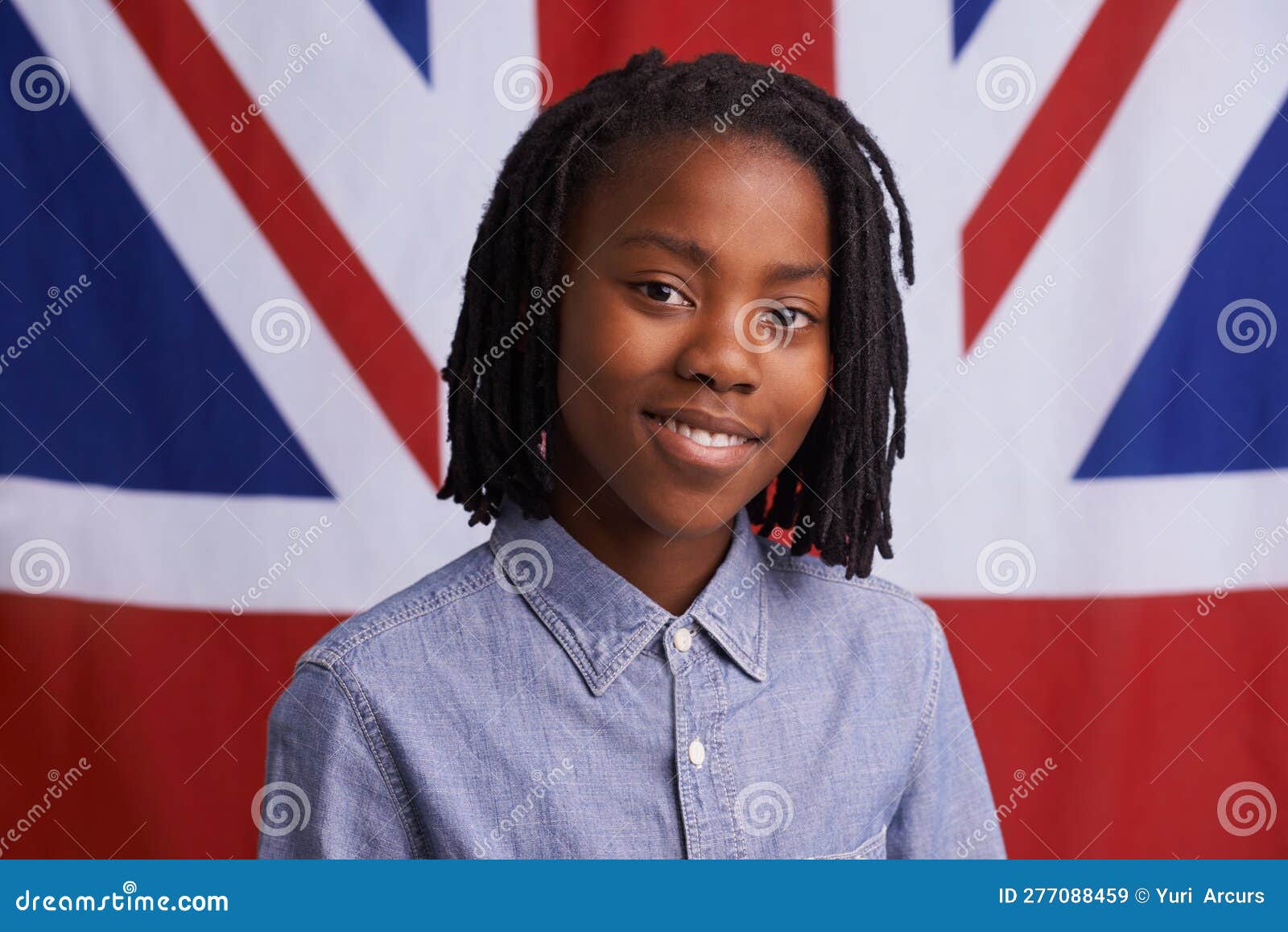 The greatest nation. Portrait of a happy young boy standing in front of the  Union Jack Stock Photo - Alamy