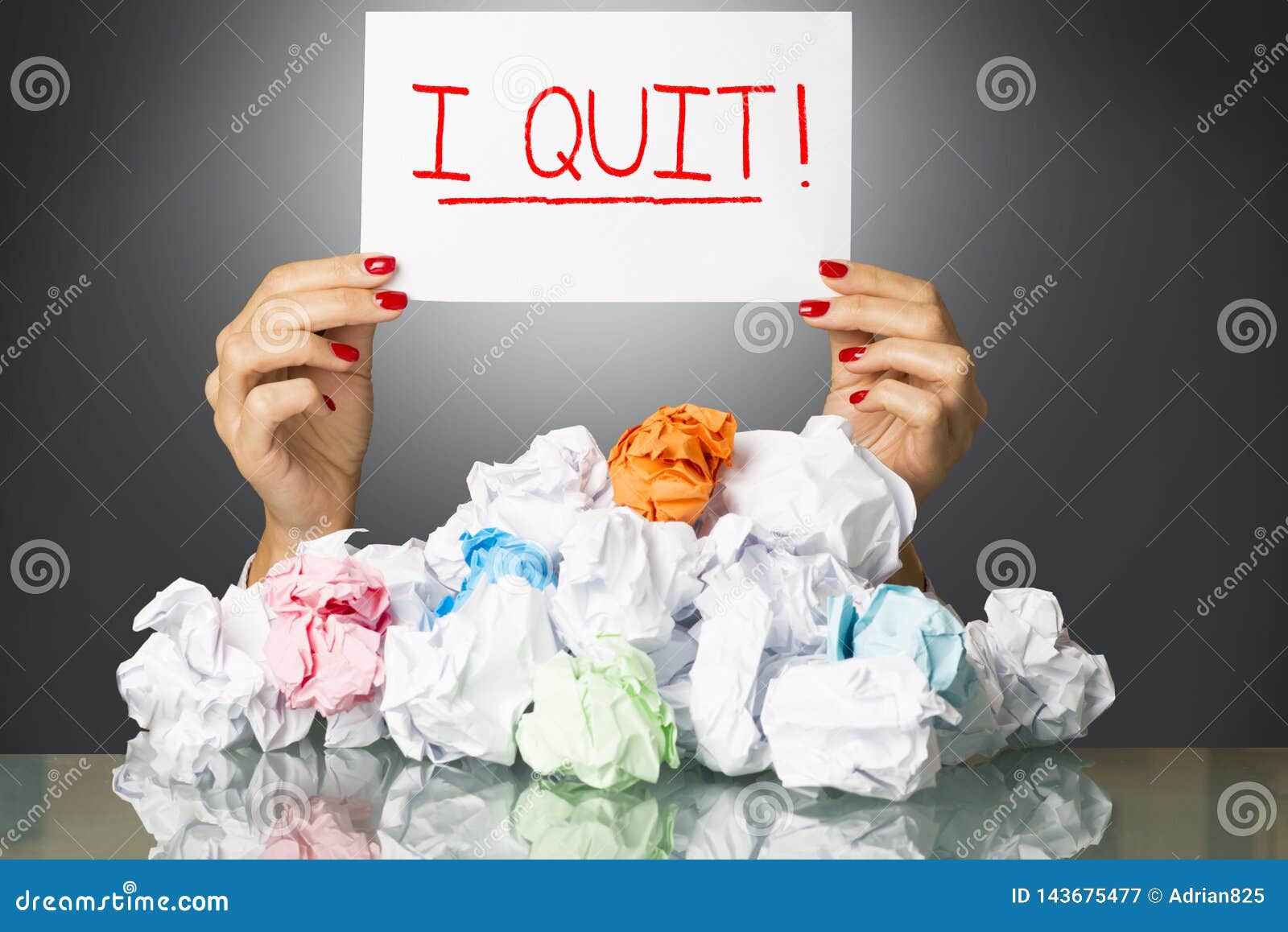 i quit, decision of exhausted employee on white paper, behind  a stack of wastepaper