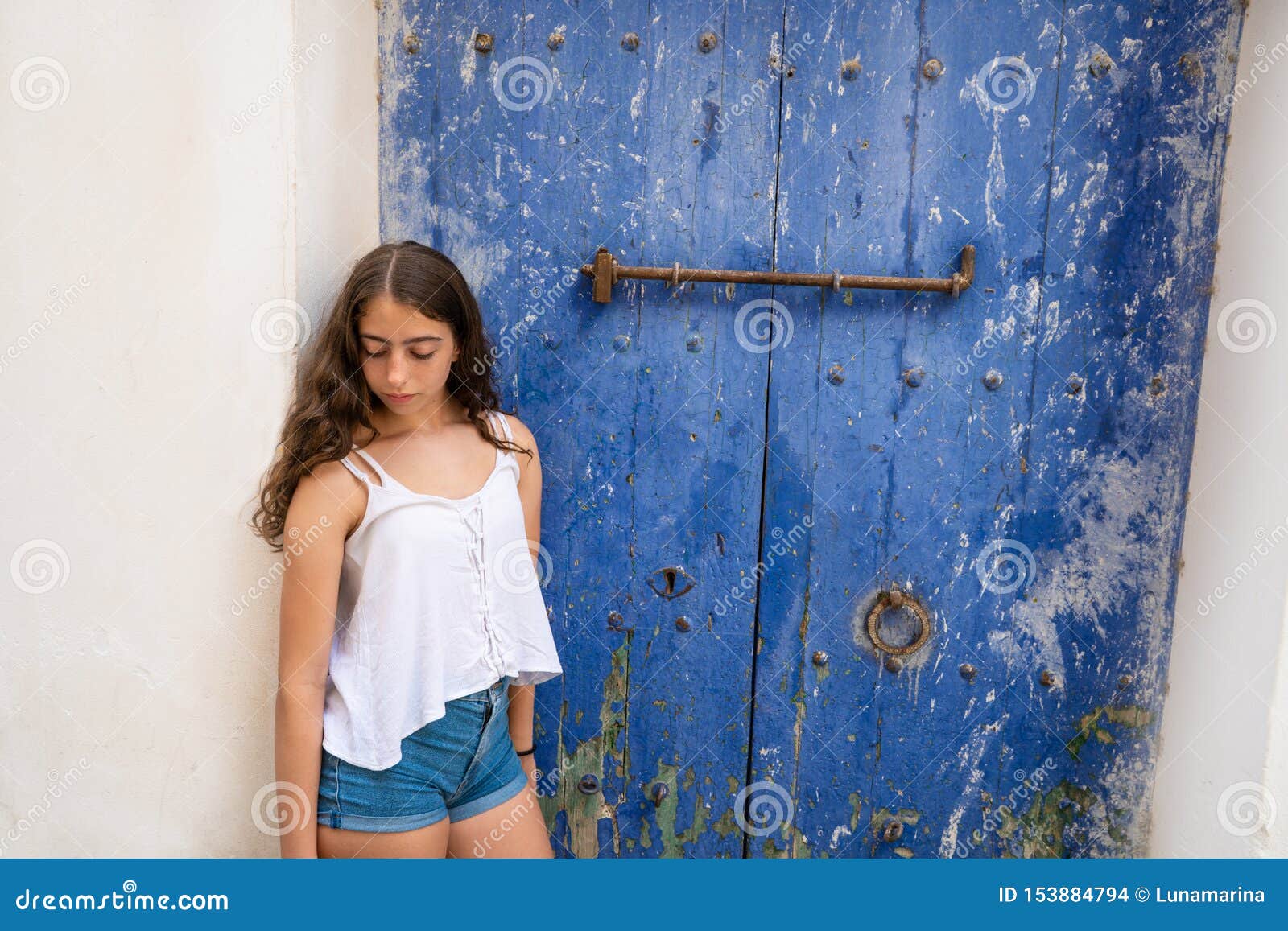 ibiza eivissa young girl on blue door